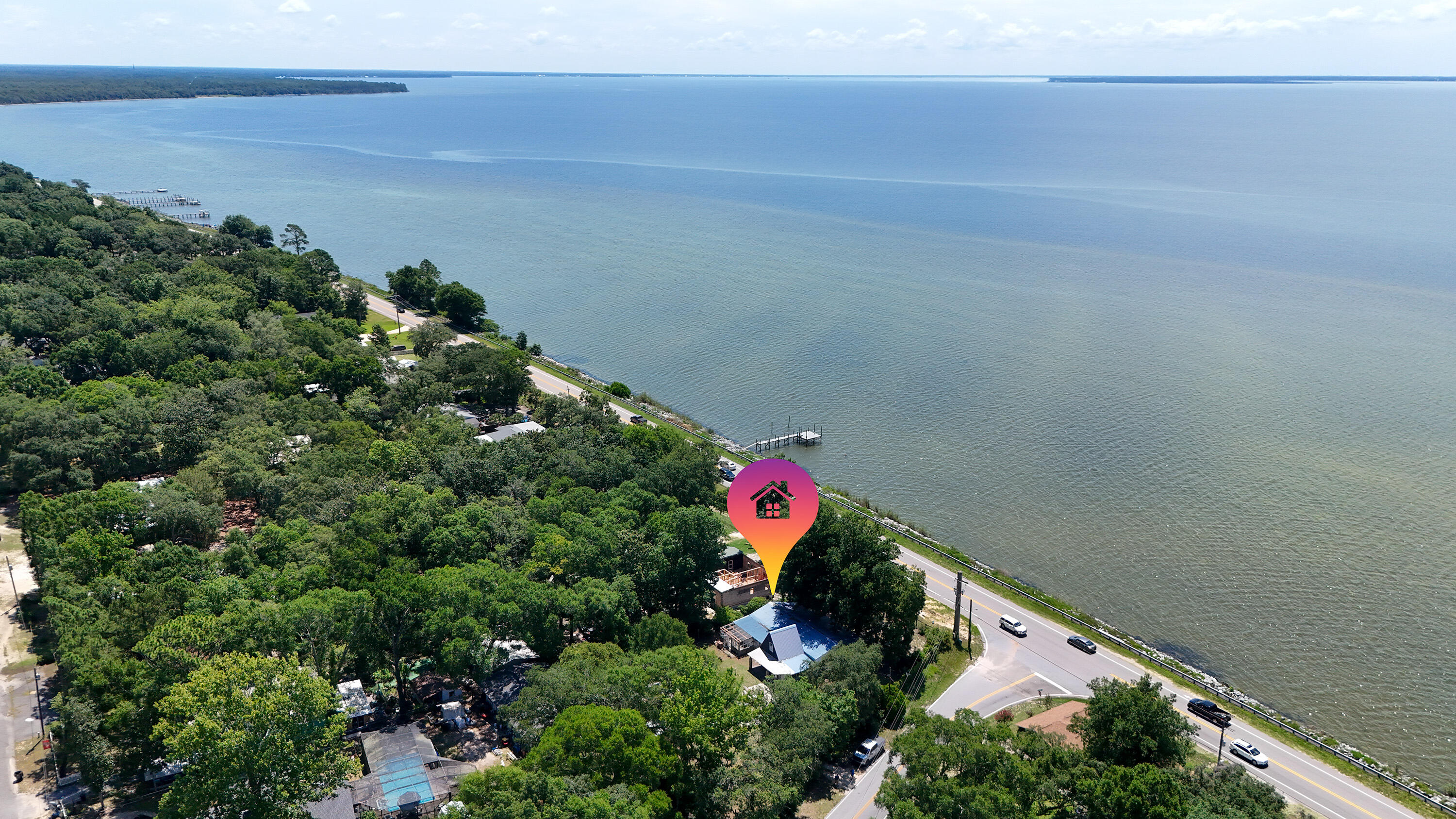 Incredible opportunity across from the Choctawhatchee Bay! This unique property spans two spacious lots, offering endless possibilities--whether you're looking to renovate the existing home or start fresh with new construction. The current 3-bedroom, 2-bath home offers great potential as a fixer-upper investment or a rental, with bay views just steps away.With two separate lots, you have the option to demolish and build two new homes, making this an ideal project for developers or investors. Enjoy serene water views and bay breezes from this prime location, just minutes from Choctaw Beach Park, boat launch, and all that Niceville has to offer.Don't miss your chance to own a piece of property in one of the area's most desirable water-view corridors--live in one, sell or rent the other, or create two dream homes. Opportunities like this don't come often!
This property isn't just real estate; it's a canvas for vision. Whether you're a developer aiming for dual-new-build returns, an investor seeking value-add renovation gains, or a waterfront enthusiast dreaming of a beautiful Bayview residence, 13636 E State Hwy 20 delivers unmatched flexibility in a serene, high-demand location. Call today and make it yours!