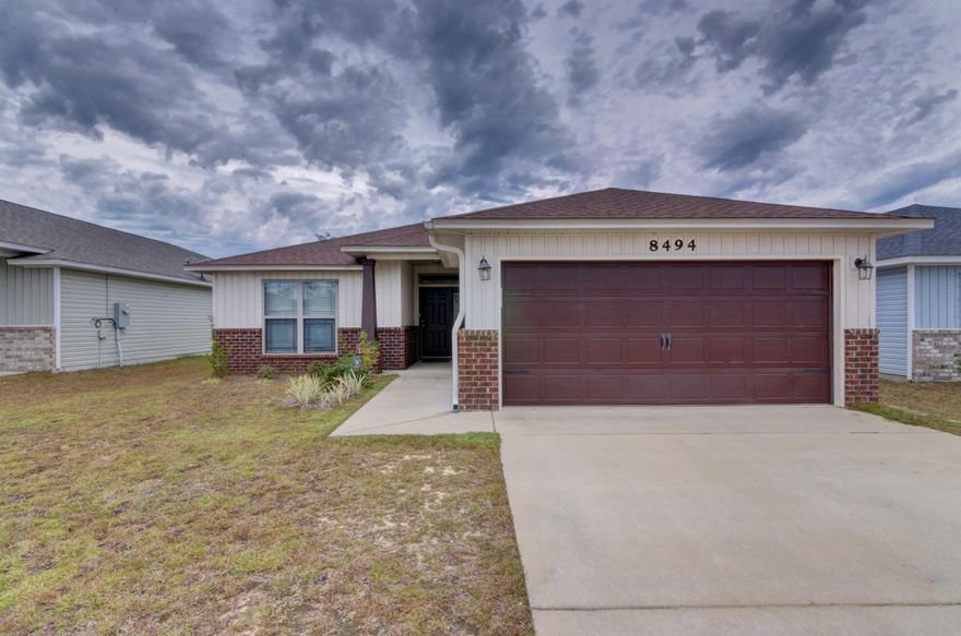 Welcome home to this lovely one owner 4 bedroom craftsman style home in East Navarre! Located near Navarre High School, the YMCA, soccer/baseball/football fields, dog park, only 20 minutes to Hurlburt Field and less than 3 miles to Navarre Beach you'll quickly find why Duncan Ridge is such a popular neighborhood! Built in 2015 this open floor plan home features granite kitchen countertops complete with a 12 foot hop up bar and kitchen island, stainless Whirlpool appliances, beautiful maple cabinetry, a walk in pantry, and tile in all the wet areas. Enjoy the benefits of living in a neighborhood (with sidewalks and underground utilities) without HOA fees or restrictions! The split floor plan provides privacy for the master bedroom which boasts a large bedroom though double doors, dual