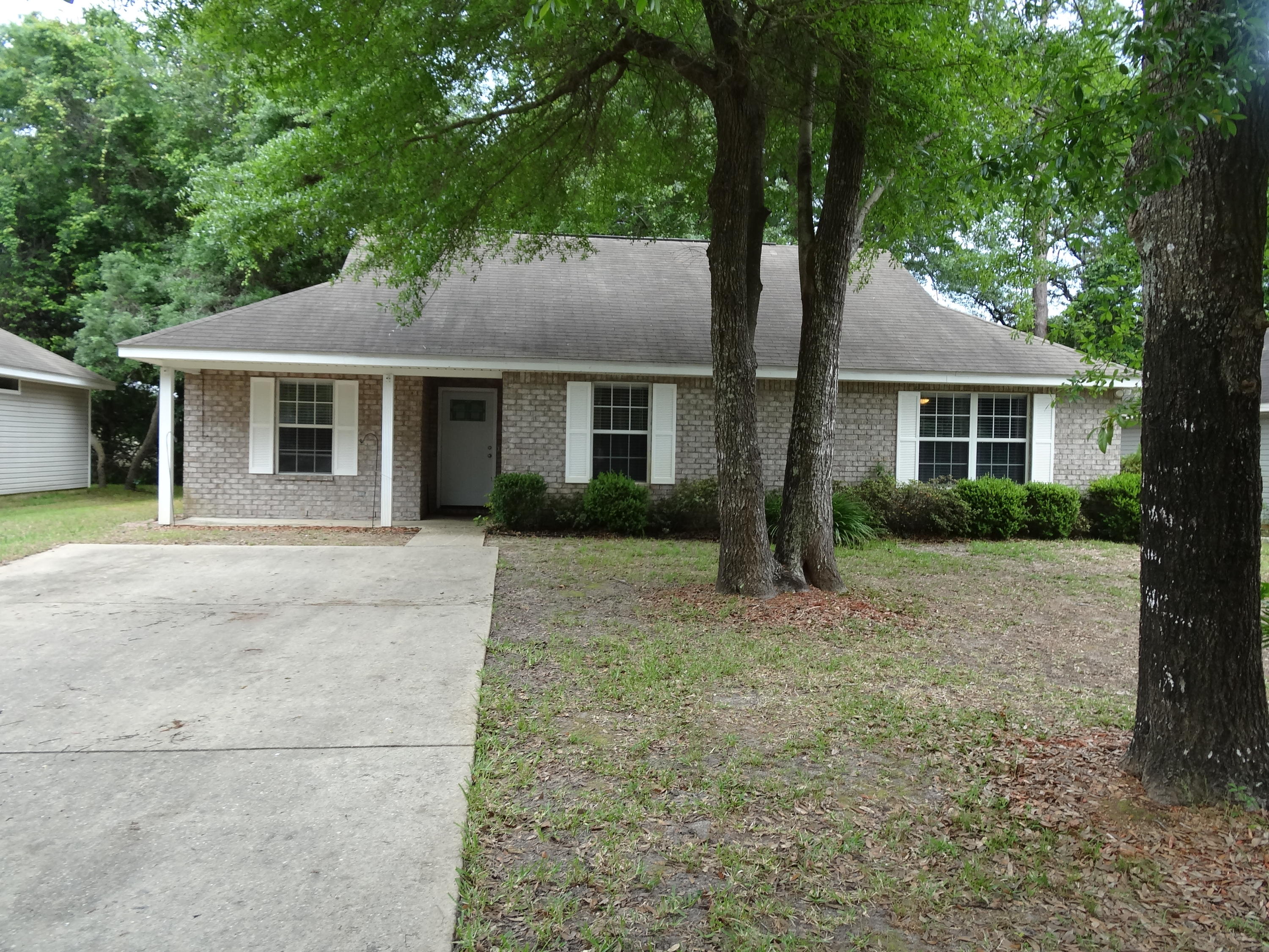 Convenient to beaches, military bases and downtown Ft. Walton Beach is a newer cottage style home on a quiet street lined with canopies of native oaks. An inviting front porch area welcomes family and friends and leads the way to a spacious living room open to the dining area and kitchen. The entire interior has been professionally painted and each bedroom has new carpeting. A door in living room leads to a back patio and privacy fenced courtyard. The bedrooms are roomy and a second bath services both additional bedrooms and guests. Low maintenance brick faade with vinyl on sides and rear. Other notables are the recently installed RainSoft whole house water filtration system valued at $6500 and the lawn is equipped with a complete irrigation system.