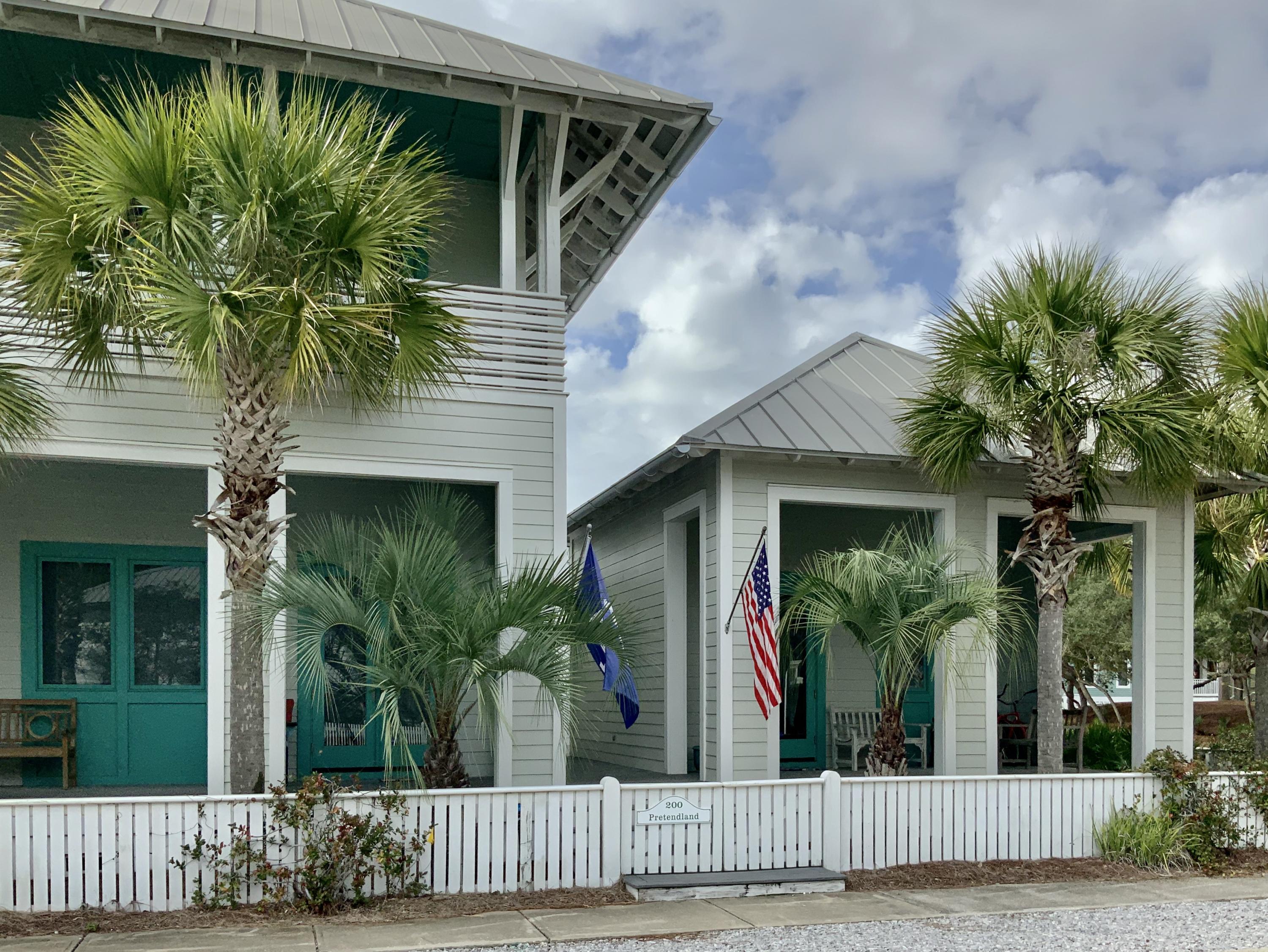 Exceptional furnished beach house designed for family living, second home, or investment property! Travertine and wood floors with ship lap accents, this house has living, dining, kitchen, half bath, laundry room, wet bar, and master suite on the first floor along with 3 bedrooms, 3 baths, and a bunk on the second floor. A separate guest cottage has 1 bedroom and 1 bath and there is a conditioned shed containing a spare washer/dryer for fishing and other outdoor gear. The house recently had a 600 sq ft kitchen, 1/2 bath and laundry room added to an already large living space with an open concept. The home has numerous porches and decks and plenty of off street parking. Located directly across the street from Bellview Park, pool, play ground, tennis courts, and basketball court.