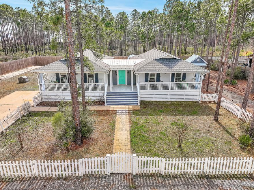 *Under contract with 72 hour kick-out clause in place.  Backup offers are welcome.*  NO HOA, parking for at least 6, RV parking! Welcome to your dream coastal retreat! This exquisite house is located SOUTH OF HIGHWAY 98 just 1.5 miles from the pristine beaches of 30A.  Golf cart ride to the beach!  Situated on a generous half-acre lot, this is a rare find at this price point and proximity to the beach. As you step inside, you'll be greeted by shiplap walls in the foyer and luxury vinyl plank flooring that continues throughout the home. The living room is adorned with an electric fireplace, creating a cozy ambiance for those cool coastal evenings. The kitchen is a chef's delight, showcasing quartz countertops, soft-close cabinets, and a suite of matching stainless steel appliances that are both stylish and functional.
This property is being sold fully furnished, making it turnkey for your convenience. Whether you're looking for a primary residence, a vacation home, or an investment property, this house is ready to meet your needs.
Enjoy outdoor living at its finest with a large covered front porch and an open back patio, perfect for entertaining guests or simply soaking in the coastal breeze. The property also includes two spacious storage sheds, providing ample space for all your beach gear and outdoor equipment. For those with adventurous spirits, the RV hook-ups with a separate driveway offer a convenient and dedicated space for your recreational vehicle. No need to worry about finding accommodations for your RV - it's all taken care of here. The roof was replaced in 2022, setting you up with added peace of mind for the years to come.