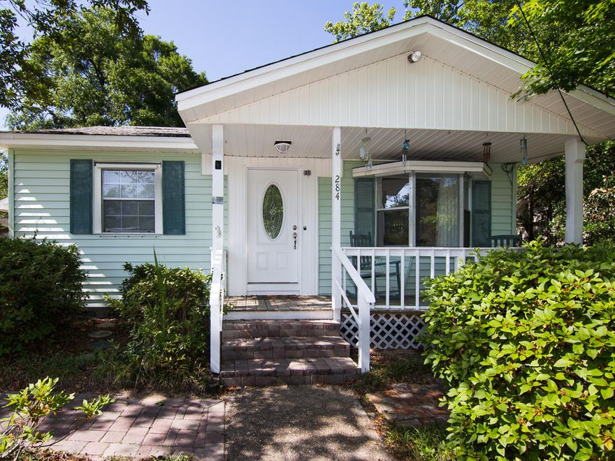 You are going to fall in love with this charming 2 bedroom 1.5 bath home on this amazing lot! There is a large dining area on the front of the house that is open to the kitchen. On the opposite side of the kitchen is a living area and huge sunroom that would make a great 2nd living, studio or playroom. There is a 1/2 bath near the living area, a large laundry room and a storage area on your way out to the carport. There are wood laminate floors throughout most of the home. The oversized backyard has a screened-in-porch and a nice workshop.