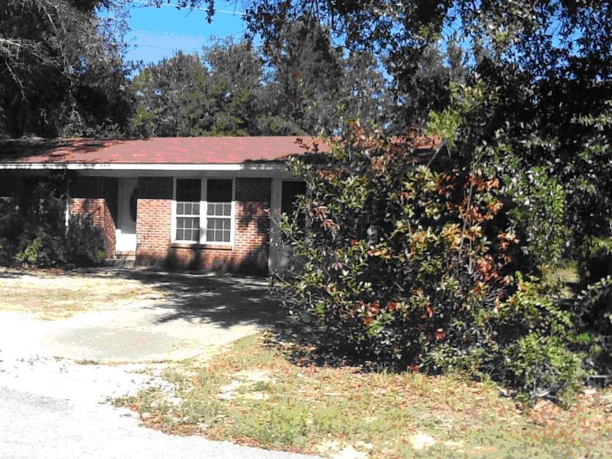 REO Property - Investors special! This 5 bedroom / 2 bath home sits on .44 acres and would make a great investment property! This home features a large family room. Next to the family room is a kitchen with an eat-in area that is also connected to a large Florida room. The home has a split floor plan with two bedrooms on one side of the home, including the master bedroom and three bedrooms on the other side of the home. The lot is large and wooded. Plenty of room to add a workshop or parking for a boat, trailer, or RV. Buyer to verify all dimensions and information, seller has no information. *This property could be schedule for an auction so get offers in!