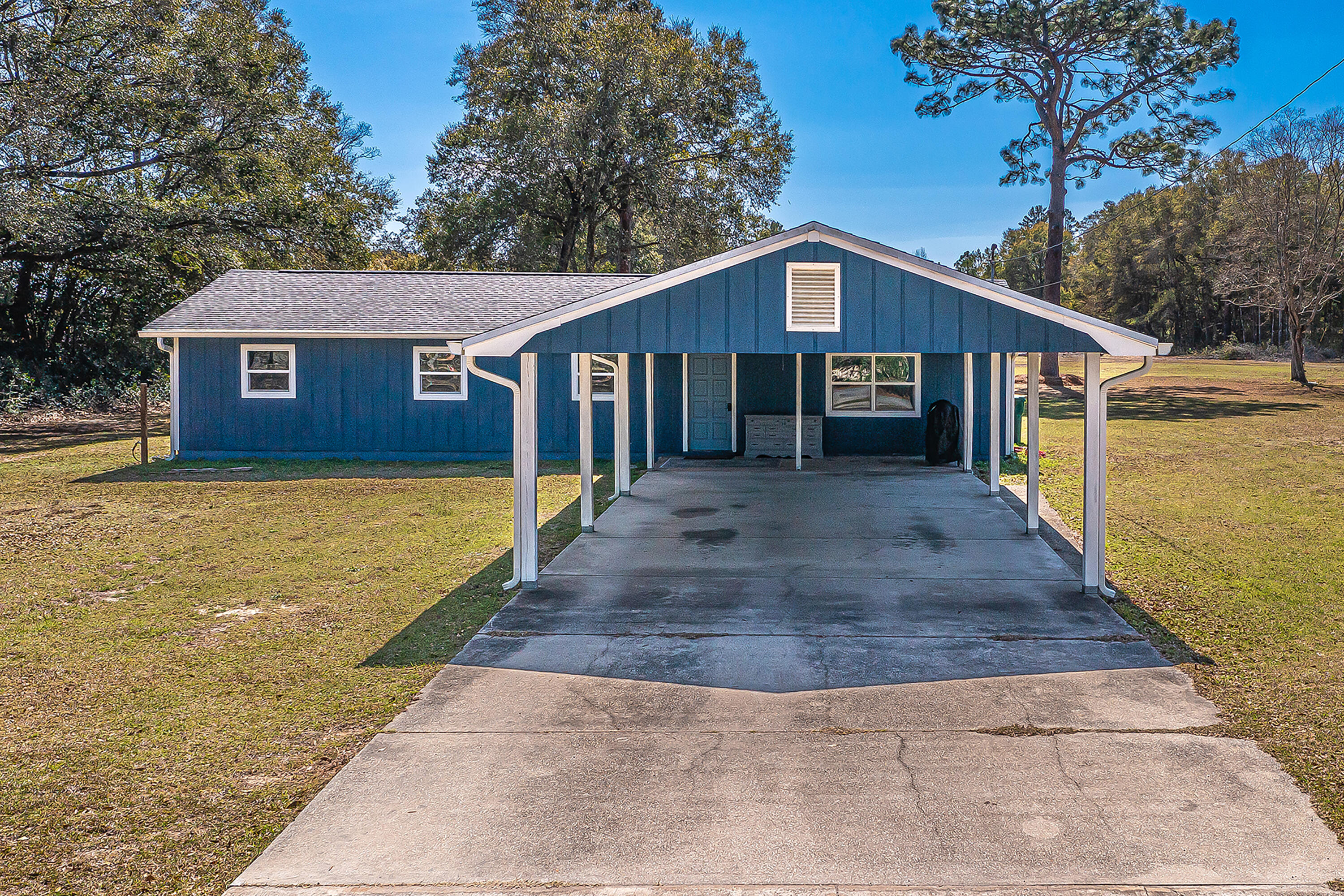 Welcome to your dream country retreat! This beautifully updated 3-bedroom, 2.5-bath ranch-style home sits on an expansive 3-acre lot, offering the perfect blend of tranquility and convenience. The open layout of the home maximizes natural light and provides wide-open views of the stunning surrounding acreage. With a spacious 6,000 sq ft barn, the property is ideal for hobby farming, storage, or creative ventures.Located just 2 miles from SR 85, you'll have the best of both worlds--easy access to Crestview's vibrant shopping and dining options, while enjoying the peace and privacy of your own secluded oasis. Whether you want to relish the land's beauty, create a personal retreat, or explore subdivision and development opportunities, this property has endless potential. The lot has access to three roads; Aplin, Holley Dr, and Earl Kennedy Rd which could provide a unique opportunity for development. Come experience the lifestyle you've been dreaming of.