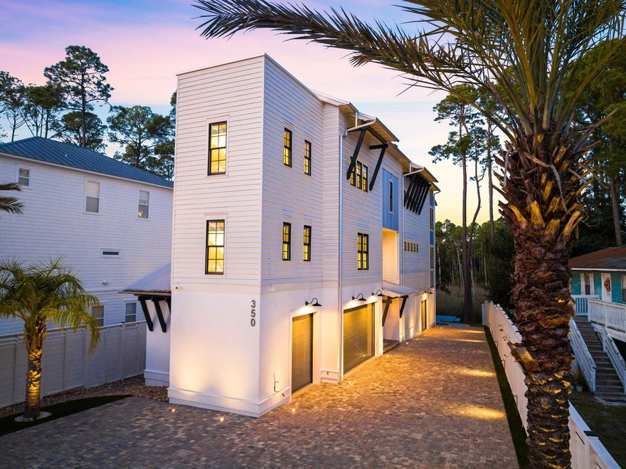 Positioned along the peaceful canals of Old Seagrove, 350 Canal Street is a refined coastal residence offering timeless design and unmatched proximity to Seaside and 30A's pristine beaches. Spanning 4,462 square feet, this four-bedroom, three-and-a-half-bath home was designed by Jeff Margaretten with interiors by Tracery and built by Billy Diesler, creating a home that feels both elegant and enduring. Crisp architectural lines, curated finishes, and a Tesla solar-powered energy system underscore the attention to detail throughout.Built to accommodate effortless living and entertaining, the home features a spacious open layout, a full executive office suite, and a three-bay garage with climate control, epoxy floors, and ample storage. Outdoor living is just as intentional, with an artificial turf yard, privacy fencing, and a private Trex dock overlooking the canalideal for launching paddleboards or enjoying a quiet evening on the water.

Situated one block off Scenic Highway 30A, this canal-front property offers rare access to both the natural beauty of Western Lake and the walkability of Seaside's vibrant town center. Whether enjoying sunset paddle sessions, entertaining guests, or simply escaping to the quiet charm of Seagrove, 350 Canal Street presents an exceptional lifestyle in one of the Gulf Coast's most coveted neighborhoods.
