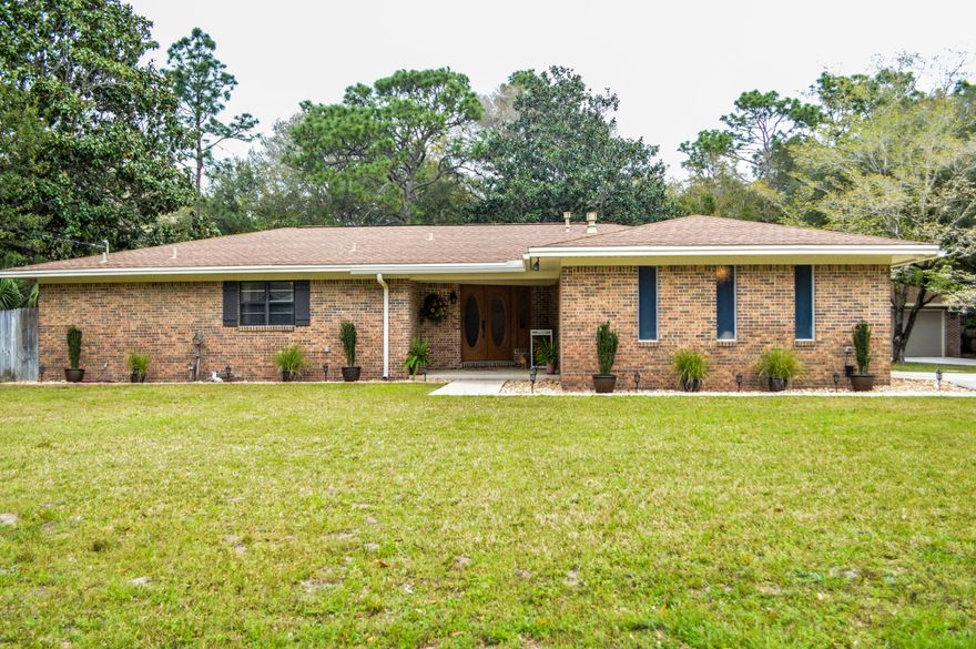 This is the home you've been looking for. A custom home on a private half-acre lot that backs up to the Eglin reservation and is only five minutes from Eglin's West Gate. 2200 square feet of living space with an additional 1000 square feet of garage space - enough for four cars and all your storage needs. This 3 bedroom, 2.5 bath design includes two living areas separated by a central kitchen - all with direct access to the enclosed saltwater pool (which makes maintenance a breeze). This home has been extensively remodeled inside and out including all three bathrooms, flooring, kitchen countertops, fireplace, rock beds with landscape lighting and irrigation, soffit and facia, greenhouse, additional detached garage, HVAC and more. Salesperson has ownership interest in the property. Easy