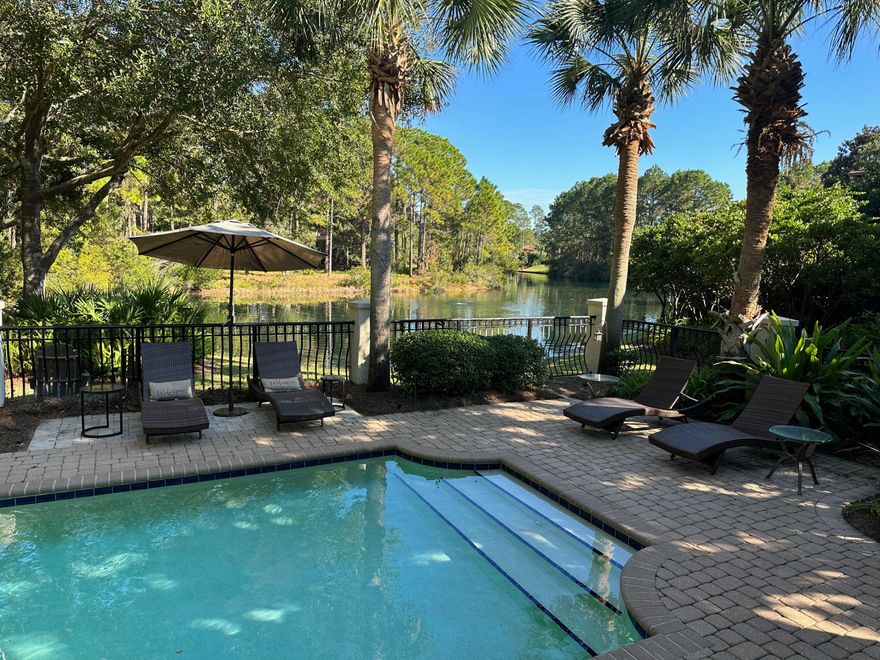 Quietly tucked away and perched lakefront in lovely Del Mar, located in the Resort of Sandestin, sits a treasure.  This three bedroom, three full bath, single story home has undergone much transformation, including converting the screen porch into a fabulous sunroom that overlooks the sparkling swimming pool and the beautiful lake beyond.  A quality Huff built home offering a popular open floor plan and each room is spacious.  ALL three bedrooms have en-suite baths, and there are lots of closet and storage space throughout, as well. The attached two car garage has added Floor Shield concrete coating flooring and metal storage units in 2021. The HVAC system was totally replaced in 2020, along with the aero seal ductwork including air sealing technology and even new interior vents and there