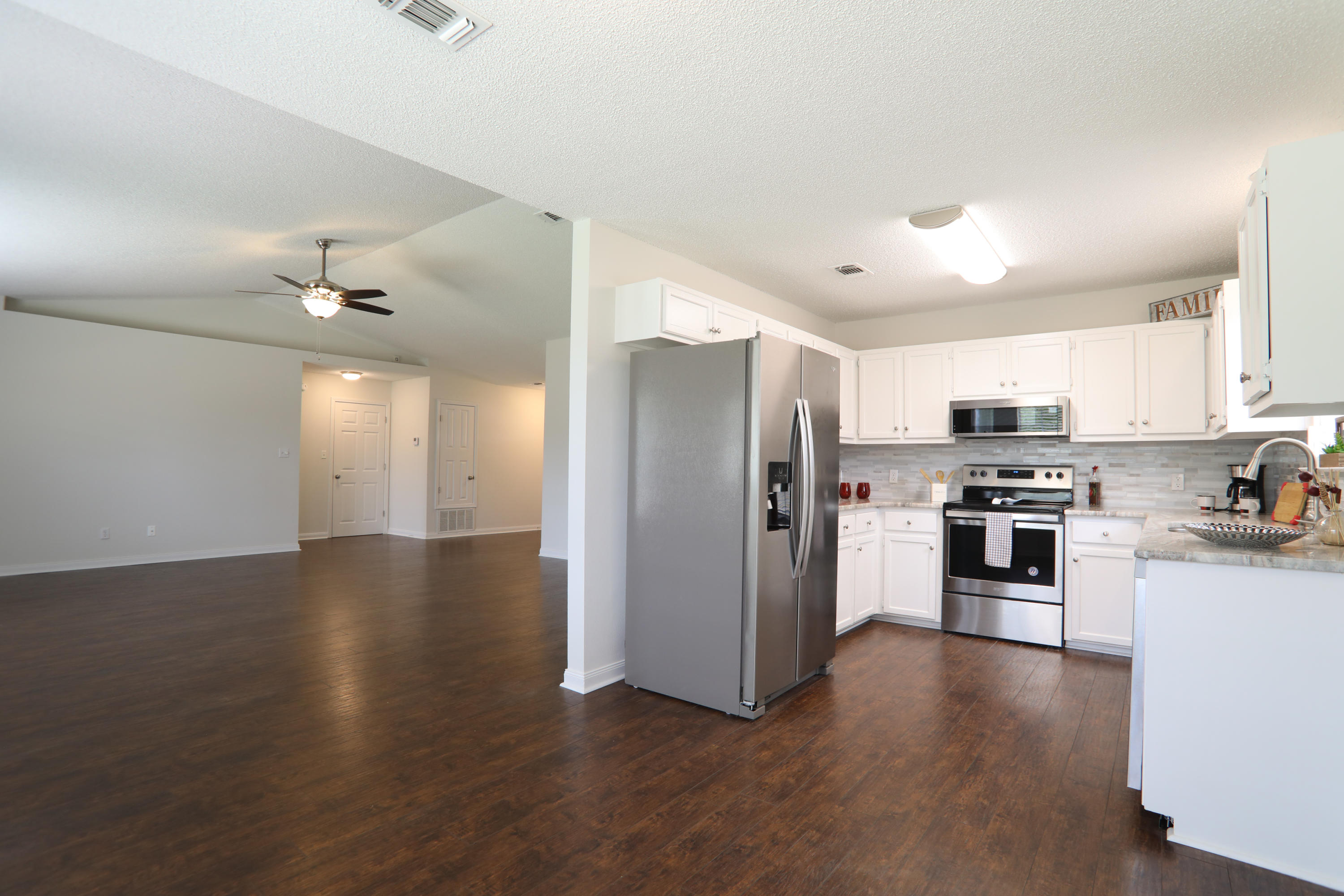 **Newly renovated home in Gulf Breeze** - Nestled nicely at the end of a cul-de-sac, this lot has a HUGE back yard. Beautifully manicured and PRIVATE, as it backs up to an undeveloped area. This must-see, updated, kitchen features granite counter tops with tile back splash, stainless steel appliances, and new light fixtures. New flooring throughout common areas and bathrooms, carpeted bedrooms, and new paint throughout. Home has new lighting fixtures and fans in living room as well as every bedroom. Garage floor complete with epoxy finish, this home is ready to be made yours! Ask for a showing today!