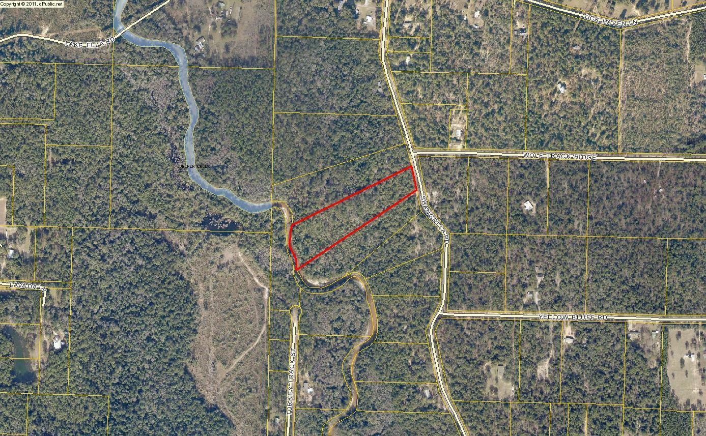 7 Acre wooded parcel with creek frontage waiting for your new home or mobile home!Some utilities available in the area, buyer to verify schools and flood zone area-if any. Not far from town, would make a nice get away.