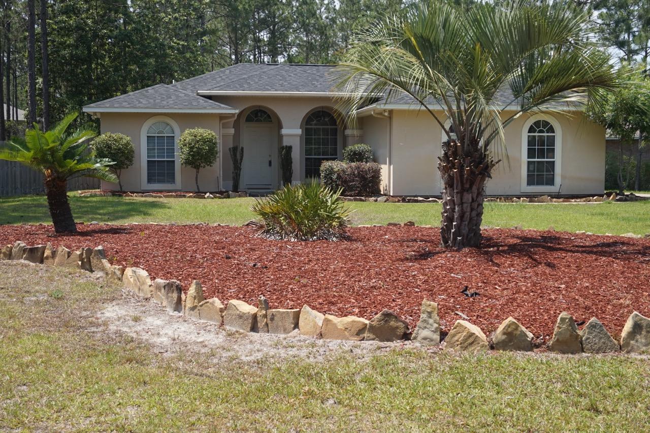 Back on the market! Buyer lost financing. Their loss will be your gain! Welcome home ..Here it is, this wonderful home is tucked away in the popular Holley By The Sea sub-division and is situated on a huge corner lot ~fully fenced with a great back garden enjoying lots of space and outdoor patio area to enjoy those wonderful Florida evenings, yard has side access double gates to store you boat or jet skis along with the side entry garage makes great space. The home enjoys a welcoming foyer & great family room with beautiful solid wood flooring, Gorgeous kitchen with white cabinets lots of counter top space ,room for standalone cabinets and coffee station .Upgraded stainless steel appliances ,large breakfast /dining area , with sweeping archway pass through from the kitchen~