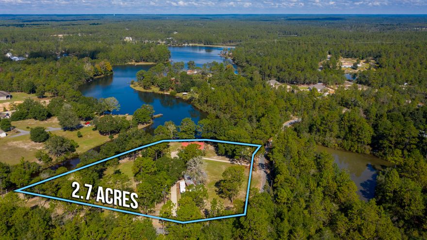 STUNNING WATERFRONT VIEWS!! Enjoy your morning coffee overlooking beautiful panoramic views of Mirror Lake! The meticulously well maintained home is located on 2.7 acres +/- w/ approximately 600' of water frontage. A rare find in this area! The home has been nicely renovated and features an inviting entry and nice sized living room. The beautiful farmhouse style kitchen boasts a center island, granite countertops and stainless steel appliances. Spacious dining area complete w/ lots of windows creating a great view of the lake and lots of natural light in this space.  The two guest bedrooms and full bathroom are located upstairs. A huge deck located just off the dining area is the perfect space for entertaining your guests. Downstairs you will find the master suite complete w/ wood burning fireplace and large walk-in closets. Beautiful master bathroom features antique dresser w/ dual sinks and a large marble shower. Lots of nice rustic touches! Laundry room located downstairs as well. Located just outside of this area is a great porch and relaxation area. Beautiful hardwood trees flank this property. Enjoy fishing off your newly rebuilt dock - lake is stocked with bass, bream and other types of fish. The boardwalk/retaining wall, manual boat launch (pulley type system) and fire pit area are all great attributes to this spot. It truly is a retreat and spot for all the family get togethers for years to come... Up the hill you will find a 24'x28' workshop w/ single car garage door, 12'x24' fully enclosed storage area w/ 12'x20' covered area, potting shed and small art studio. A truly unique property! Make your appointment for a private tour today! 