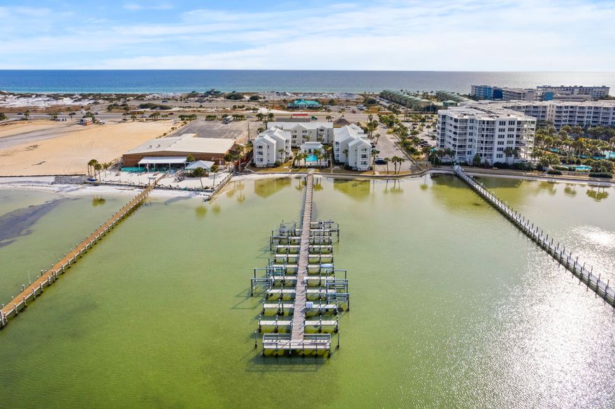 Best of both worlds, the BEACH and the BAY! Rental Projections up to $35,000 with this coastal design renovated unit at Hermitage Condominiums, uniquely positioned to offer more than just a place to stay. This property stands out in this complex, providing not only a stunning view of Choctawhatchee Bay but it is the top unit and located on the closest corner to the bay.   Also, this condo complex is directly across the street from the John Beasley Park with public beach access on Okaloosa Island which is famous for their white sandy beaches and emerald green water.  Imagine overseeing the joy of your children playing in the pool or exploring the shores for crabs at the quaint inlet beach, all from the comfort of your home on your private balcony.Strategically located right