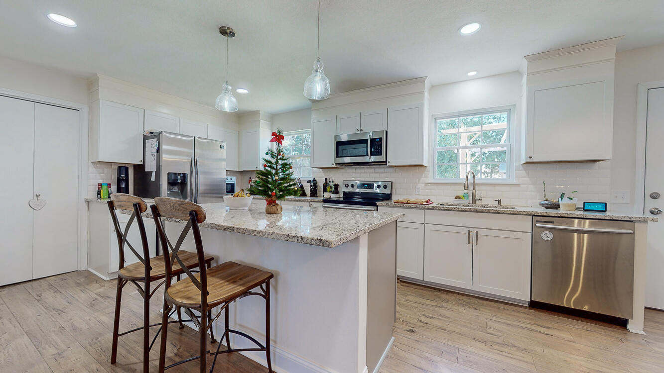 Welcome to your dream home in the heart of Central Fort Walton Beach! This delightful residence boasts a classic white-washed brick exterior, complemented by a durable metal roof, offering timeless curb appeal. Located just 4.1 miles from the pristine sandy white beaches, and surrounded by convenient shopping and delectable restaurants, this property epitomizes both comfort and convenience.Step inside to discover a spacious interior adorned with beautiful 12 mm laminate floors throughout and tasteful tile in the bathrooms. The expansive open kitchen is a chef's delight, featuring a large kitchen island and elegant granite countertops, creating the perfect space for culinary creativity and social gatherings.Upgrades abound in this meticulously maintained home, including a newer