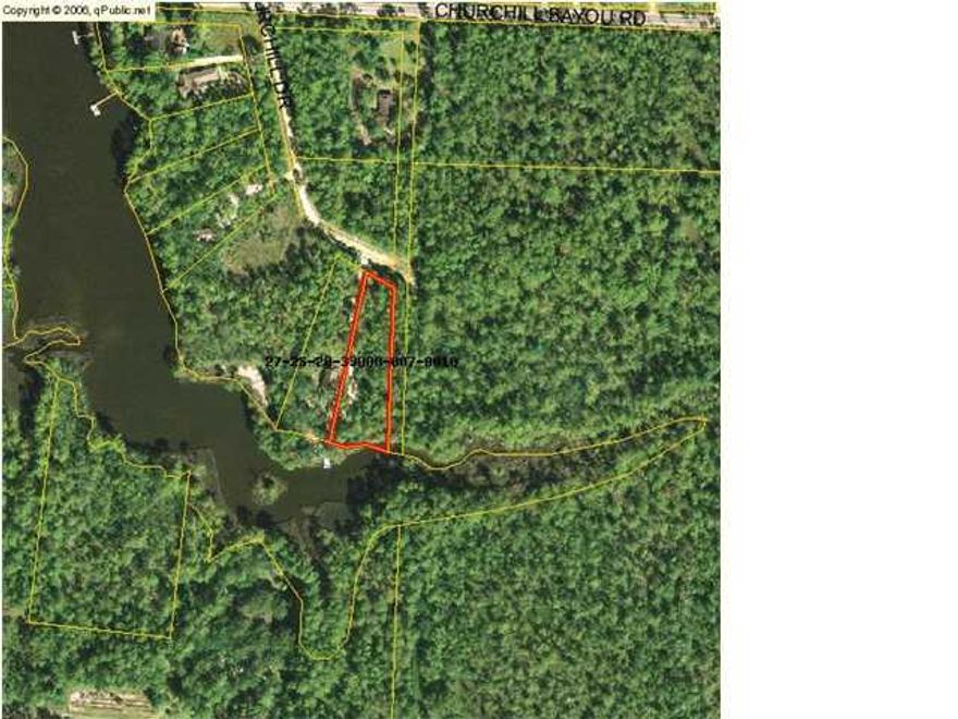 Large lot with 135 feet of frontage on Churchill Bayou with direct access to the bay. Water is shallow at this end of the bayou so it's not the perfect lot for the boating enthusiast. It is the perfect lot for a serene, peaceful, private homesite. Beautifully wooded .9 acre lot that borders state forest land on the east. Truly the perfect lot for the nature lover that wants beautiful water views to build their dream home. No build out time and no HOA. Lot dimensions taken from county records. Buyer to verify. Survey available.