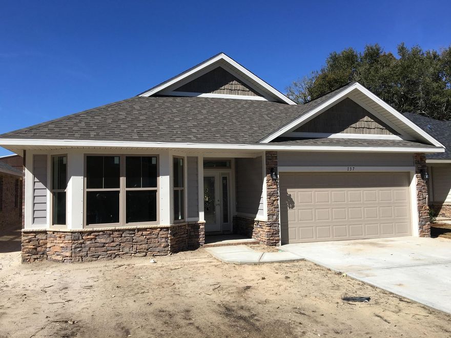 New plan for Whitworth ''Crystal Bay'' Enter from the front porch into a spacious foyer. This home offers split floor-plan with Tile in all wet areas and dining area. Enter the kitchen with 3 cm granite counter tops and Stainless Steel Appliances. Energy features include 2x6 exterior wall construction offering a R19 insulation rating. Large windows bathe each room with tons of natural light. This open floor plan boasts a designer kitchen with beautiful granite countertops and an impressive dining cafe. All overlooking Family room with dual ceiling trays climbing to 11' Large Tiled Walk-in shower in Master Bath. Brick 3 sides and Hardy Board and brick on the front.