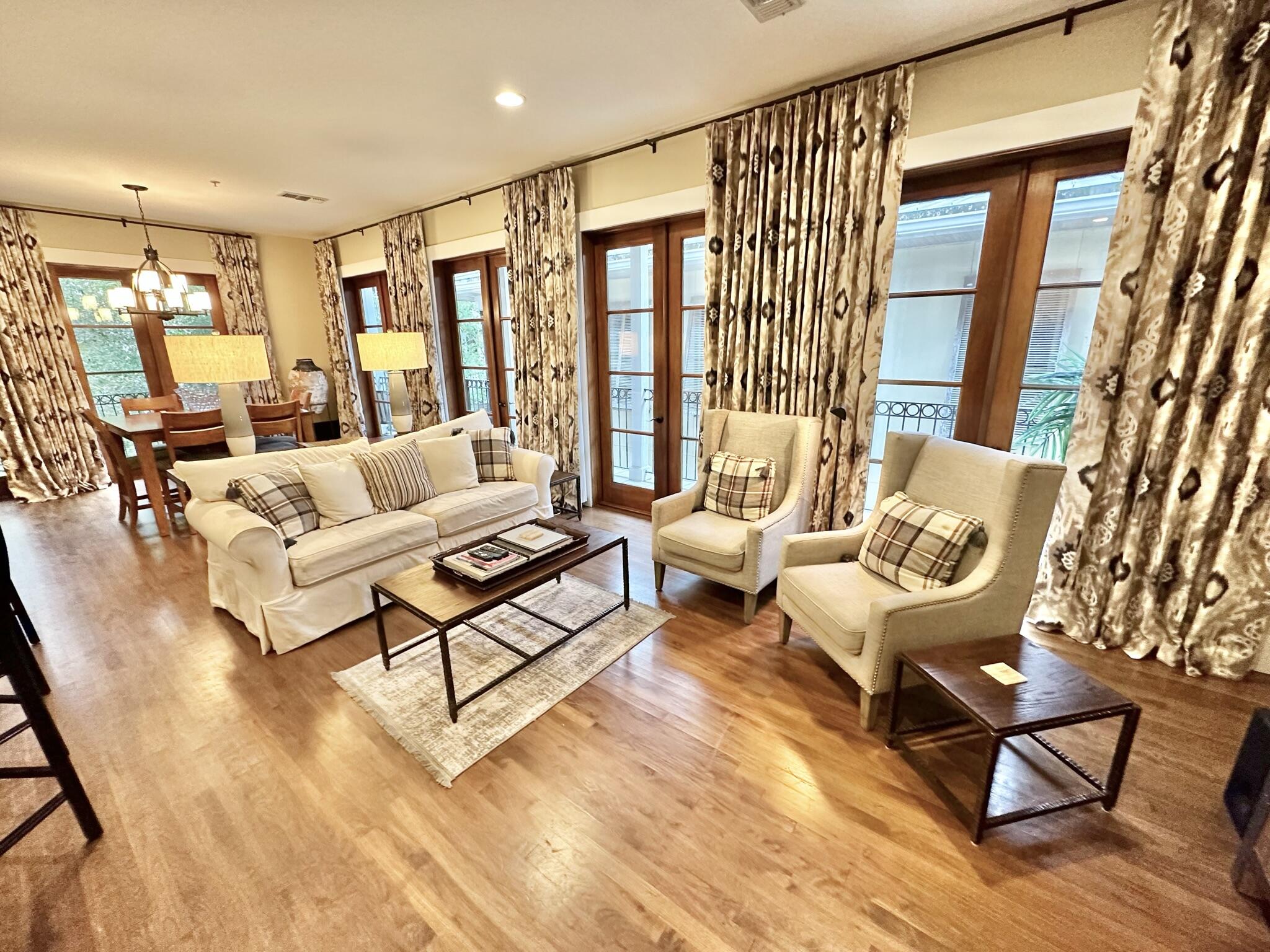 Welcome to the epitome of luxury living in the heart of the pedestrian Village of Baytowne Wharf, nestled within the gated master planned community of Sandestin in Miramar Beach, Florida. Experience French inspired charm right here in Fisherman's Village, where sophistication and coastal allure harmonize in this exquisite loft-style condominium. As you step inside, you'll be captivated by the open floor plan that beckons you to entertain with style and grace. Six magnificent mahogany French doors gracefully frame the living space, leading to a sweeping wraparound balcony that offers views of Tupelo Courtyard and the charming lanes below. This vantage point provides the perfect backdrop for enjoying leisurely evenings and taking in the vibrant energy of the village. Special Owners Parking Inside, the rich wood flooring and tasteful brick accent walls create an ambiance that is both cozy and opulent, making this residence a tranquil coastal retreat. The wet bar, complete with a wine fridge, ensures that your favorite beverages are always close at hand, perfect for both intimate gatherings and lively soir??es.
Convenience is key, with walkable covered parking spaces just across the lane from your discreet entry door, shared with only one other neighbor. Whether you're heading out for a morning stroll or returning from a day of adventure, ease of access is always guaranteed.
Step outside to the Amenities Terrace, where a world of relaxation and recreation awaits. Take a dip in the beautiful pools, unwind in the spa, challenge friends to a game in the well-appointed game room, or savor the flavors of outdoor grilling. Gather around the outdoor fireplace, whip up culinary delights in the fully equipped kitchen and bar area, or simply bask in the lush greenery and meticulously landscaped surroundings. From here, you'll enjoy breathtaking views of the Events Plaza, and it's a prime location to catch the spectacular fireworks displays that light up the night sky.
As a Sandestin Owner, you'll be privy to a plethora of amenities within this exceptional community, from pristine golf courses to world-class dining, shopping, and entertainment options. Plus, the convenience of walkable covered parking spaces right across from your front door ensures that every day is a breeze.
For added convenience, a dedicated owner's storage locker is provided in the garage area, offering a place to store your beach gear and personal belongings.
Experience the pinnacle of coastal living in this exclusive French-inspired loft within the heart of Sandestin's Fisherman's Village. The ultimate blend of style, convenience, and luxury awaits you in this remarkable condominium. Don't miss your chance to make it your own and embrace the quintessential Florida lifestyle in absolute elegance.
Watch movies and enjoy music and special events downstairs in the Events Plaza.
Sandestin Golf and Beach Resort features more than seven miles of beaches and pristine bay front, four championship golf courses, 15 world-class tennis courts, a 226-slip marina, a fitness center, spa and celebrity chef dining. Shop, dine and play at the charming pedestrian village, The Village of Baytowne Wharf and more. Inside the gates of the resort, residents enjoy a balanced lifestyle of high-class living, spanning the 2,400 acres from the beach to the bay. Everything within the gates of the resort is accessible by golf cart or bicycle. The entire resort is interconnected by miles of pedestrian, bike and golf cart paths that weave through groves of live oaks, meandering past natural lagoons, fountains, man-made lakes, and meticulously landscaped fairways.