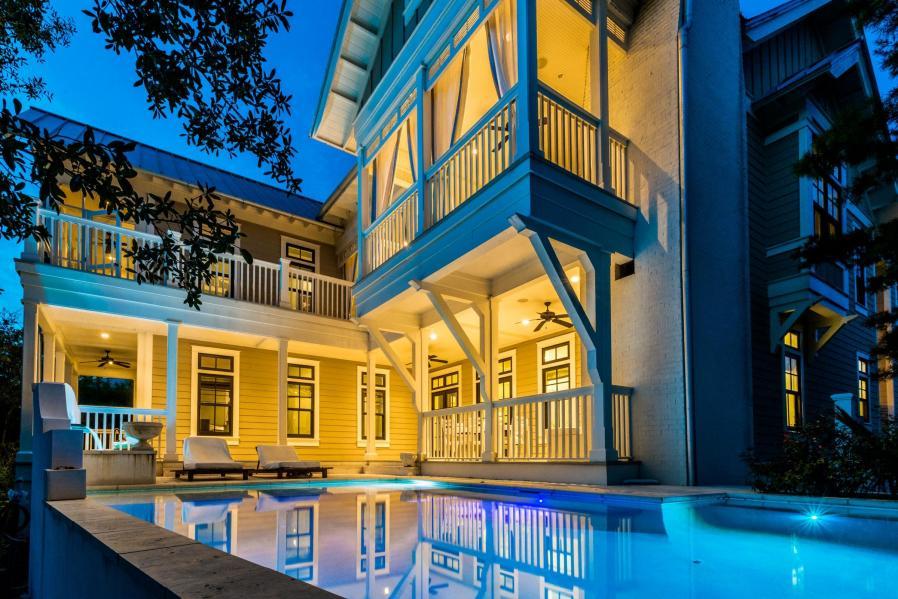Call today to schedule your private showing for this outstanding lakefront home located in the coastal town of WaterColor. This custom home has unique finishes and details that you will not find in other Watercolor homes including 8-12 reclaimed antique heart pine floors and over $70,000. worth of Audio Visual Equipment throughout all 3 levels of this home. Three sets of french doors off the main living area open onto the outdoor living area with sweeping views of Western Lake. The pool and fountain area are the perfect spot to relax and enjoy the privacy afforded by this location backing up to preservation land and Western Lake. No one can ever build behind you to block these amazing views!! The second story outdoor living area comes complete with a Wolf grill, custom built BBQ