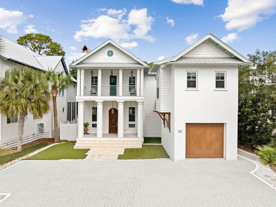 Newly updated!! Welcome to the immaculate custom home in the heart of Seagrove Beach! Featuring an open floor plan with soaring 14 foot double height ceilings, creating a grand and inviting space.  Upon entry, you'll find a cozy fireplace in the living room that leads directly into the perfectly designed kitchen, complete with dual islands and luxury appliances. Just off the kitchen you step outside to discover the resort style pool with sun shell surrounded by an expansive covered porch and open outdoor living space. This porch is fitted with motorized screens for effortless indoor outdoor living. The main floor also includes a private master suite for the ultimate in luxury convenience. Upstairs, the luxurious primary suite awaits, featuring reclaimed pecky cypress ceilings, heart pine beams, and a brick fireplace. Three additional bedrooms on this level are crafted with unique finishes, adding charm to each space. Above the single-car garage, a separate one-bedroom studio-style carriage house provides a perfect guest suite or private retreat, completing this exceptional Seagrove Beach property.

Additional highlights include antique white oak floors, a modern staircase with braided steel railings, and custom tile work throughout that enhance the home's elegance and character.