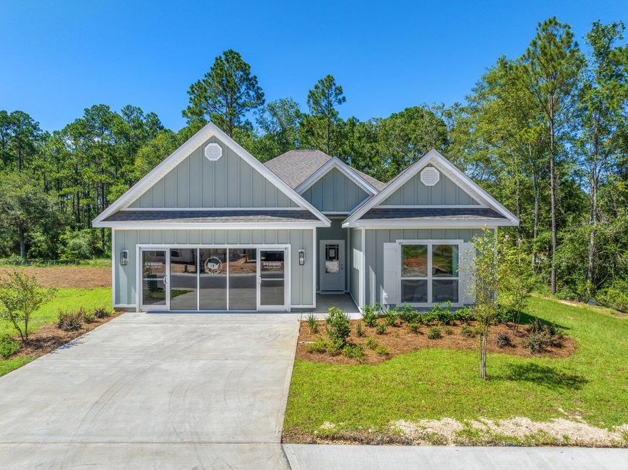 Walton's Landing is less than 4 miles to the public beach accesses on Scenic 30A. This short-term rental-friendly community features a community pool, walking paths, and ponds for endless hours of outside enjoyment central to both Destin and Panama City Beach. | The Kennedy plan is a 1 story home featuring 4 bedrooms, 3 bathrooms and EVP flooring throughout. The Kennedy offers an open living area and a beautiful kitchen with quartz countertops and Ivory Shaker Cabinetry. The primary bedroom is spacious and the en-suite features a modern tiled shower, bathtub and large closet.