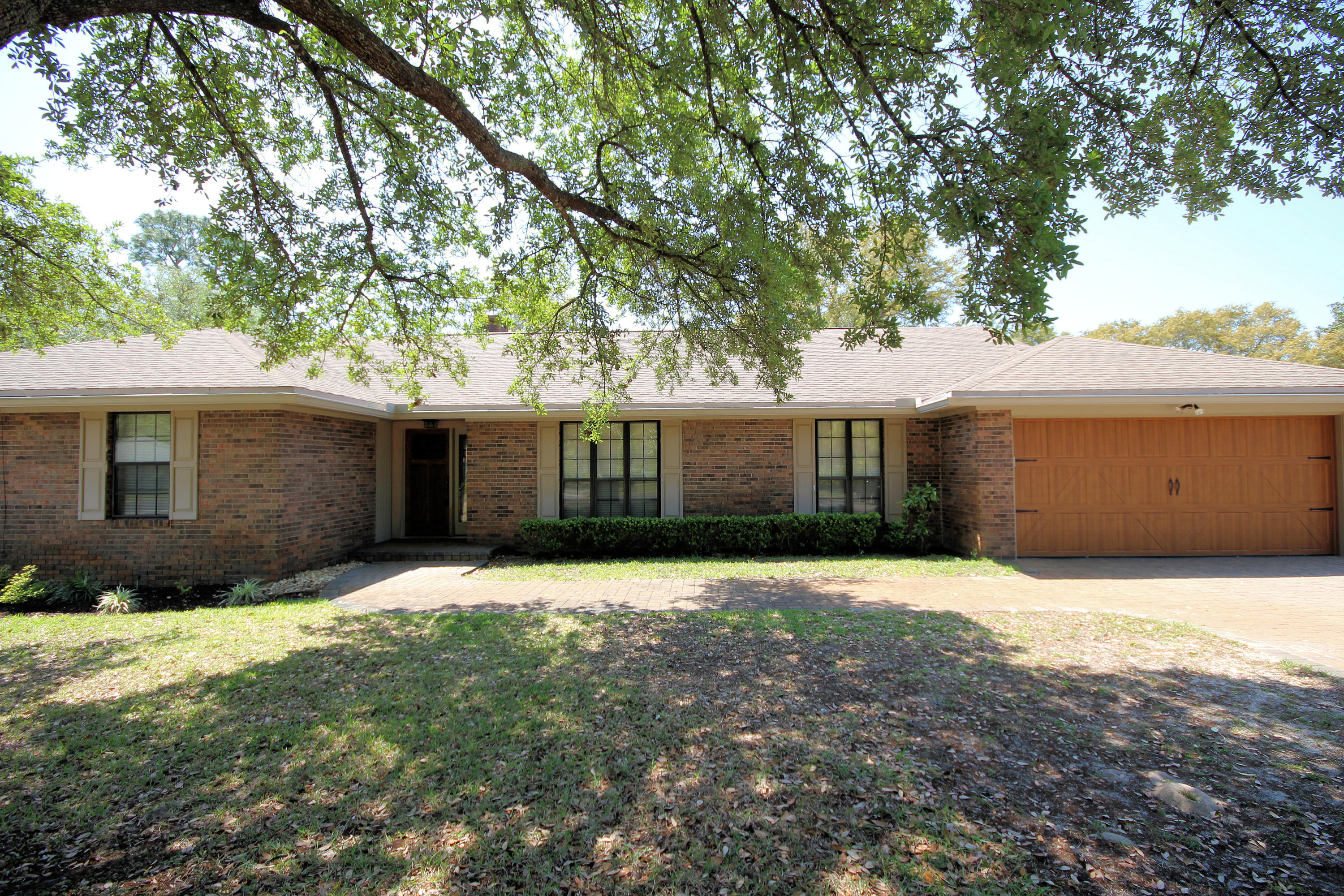 GOLF COURSE HOME!! This charming one owner home is located on the 6th hole of Shalimar Pointe Golf Course. Hardwood floors throughout, bedrooms have New carpet. The home offers a spacious updated kitchen with granite counter tops, stainless steel appliances, and tile back splash. The breakfast area and heated/cooled Florida room overlook the golf course. Wainscoting in the breakfast area and hallway. Large fenced yard with brick patio. Spacious living room with gas fireplace, which has custom mantle and brick hearth. This home has a ton of storage. Very large master bedroom with sliding door to Florida room. Two closets and an updated master shower. Great neighborhood! Two hot water heaters and a new 16 seer Lennox air conditioner. Great home! Stop by today with your buyers.