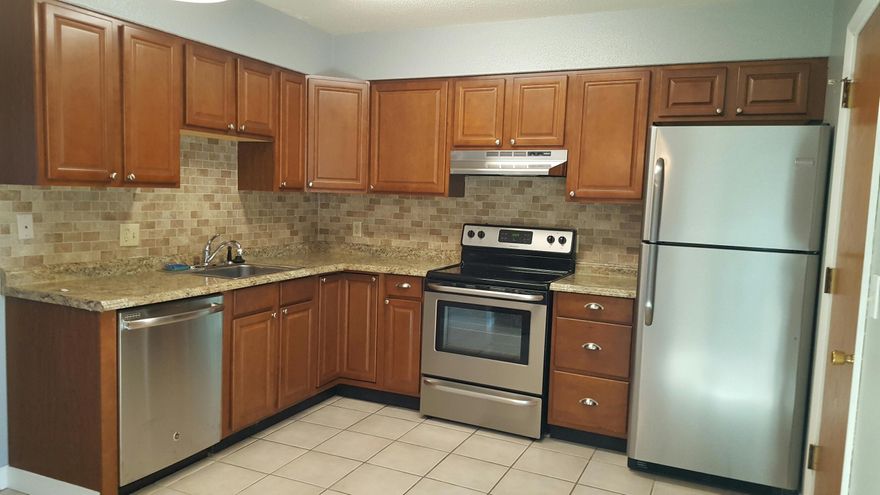 End unit townhome in central FWB. Exterior siding is Hardi-board for durability and care-free maintenance. Kitchens, baths, and flooring have been renovated. New stainless steel appliances. All new paint, walls and woodwork. Ceramic tile throughout 1st floor and carpeting on steps and in bedrooms upstairs. Large laundry room off kitchen with plenty of storage space and a separate outside entrance. New sliding glass doors in dining area leading to a private patio. AC is 2 years old, roof is 7 years old.