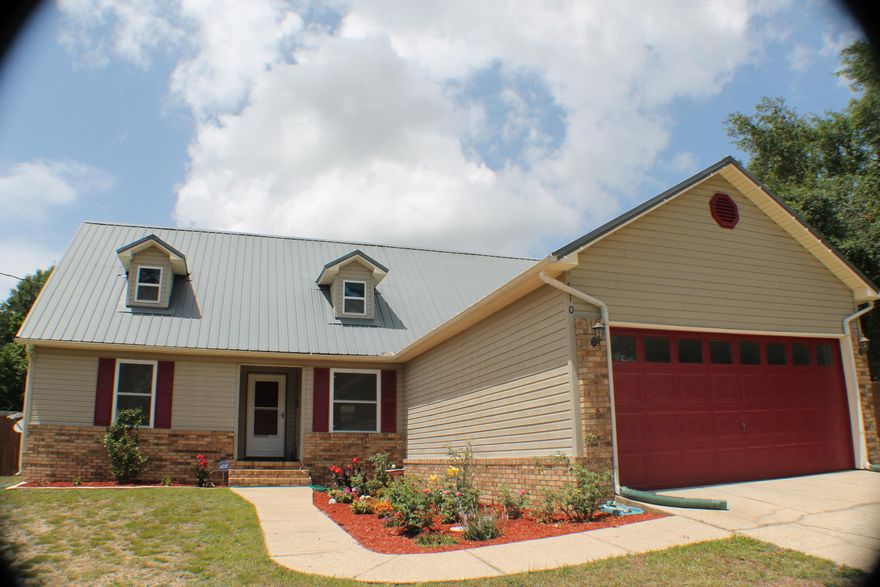 Huge Fenced in Yard, South of town in ground pool, covered porch and a Hot tub! 5-bed room 3 bath bring the family and the friends for entertaining! This gorgeous 5 bedroom has a huge living area, two master baths, a huge garage and a beautiful kitchen! Stainless appliances gas stove and a tank-less gas water heater so the shower never runs cold even with the largest family! There is a wood burning fireplace, tile floors in the main living area and the kitchen. Come home to South Crestview today! The Location is perfect for a quick commute to I-10, The whitest beaches in the world and the area military bases., Eglin, Duke and the Army 7th is a short drive away. Don't forget to pack the floating chair!