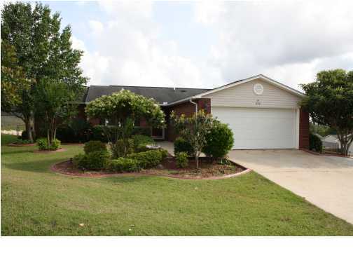 As you enter the front door, you will notice the beautiful lead glass oval door and etched glass storm door to welcome you in. The large, open living room has tile flooring and vaulted ceilings. Living room opens into a light and spacious kitchen. Tiled flooring, white cabinetry, brushed bronze pulls, eat in area, and a built in desk are just some of the features. Dishwasher, electric stove, built in microwave and white side by side fridge with water and ice in door complete the kitchen appliances. Formal dining room has chair railing and is located off the kitchen. Bedrooms are a split floor plan design with a spacious master bedroom and two additional bedrooms. The sun room is heated and cooled and tiled floors. Large deck, fenced backyard, and 2 car garage complete this home.