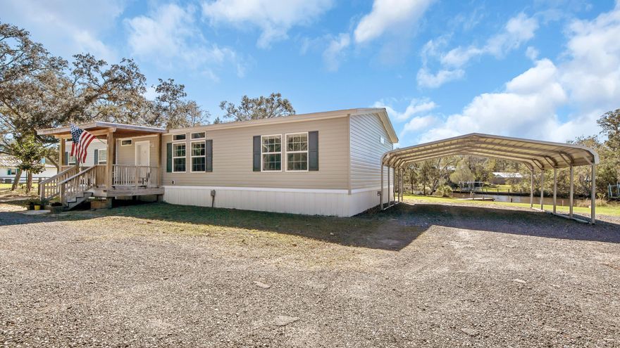 Come check out this beautiful, meticulously kept 2015, 3 bedroom, 2.5 bath double-wide manufactured home on approximately 0.91 acres with 218 feet of canal frontage that leads out into Mallet Bayou to the Choctawhatchee Bay. This open concept, split floor plan home has everything you want for convenient living. Swing on your front porch or back covered deck facing the water when you get ready. Fish from your dock or have a short boat ride to the bay; the choice is yours. Have an RV? RV pad is already in place. Gas stove, Refrigerator, Washer and Dryer, Conex for storage all convey at closing. Call today before it is gone.