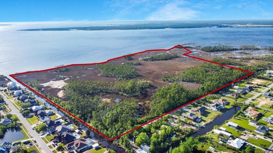 Approximately 81% wetlands (71.2 acres) and 19% uplands (18.5 Acres). Zoned Conservation-Habitation (CSVH) within unincorporated Bay County. CSVH allows for 2 units per acre and a minimum lot area of 1/2 acre. An exceptional opportunity to own a one-of-a-kind 88-acre waterfront property on North Bay in Lynn Haven. This expansive tract features stunning sunset views, with a mix of uplands and lowlands. Ideal for a private estate or a thoughtfully planned low-density residential development similar to Northshore Islands to the south in which the uplands ''islands'' are connected with a series of bridges. With additional access from Pinetree Road, this property offers flexibility, privacy, and natural beauty rarely found in the area. Whether you're looking to build a  you're looking to build a secluded luxury sanctuary or explore the development potential, this remarkable piece of land provides several possibilities. Please contact agents for more details, studies, site plan, wetlands map, flood maps etc. A canal cuts-off the main access trail along the south property line. Don't miss your chance to secure one of the last large waterfront parcels in Lynn Haven. Contact listing agents to schedule property tours