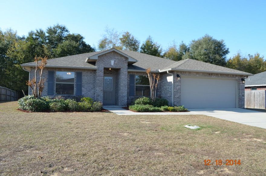 Wow. This home is in the very heart of Pace in the Tiburon West Subdivision. This home is only just built in 2009 and has all brick exterior with 2 car garage and covered lanai. Inside this home has new carpet, paint, and is ready for new owners now! This floor plan is a split bedroom design with 3 bedrooms with 2 baths as well as Master bedroom and master bath. The laundry is just off kitchen and the kitchen is open to the Great Room. Inside you will also find dining area and a den which could easily double as an office or even a 5th bedroom. This one won't last so call today for your showing!