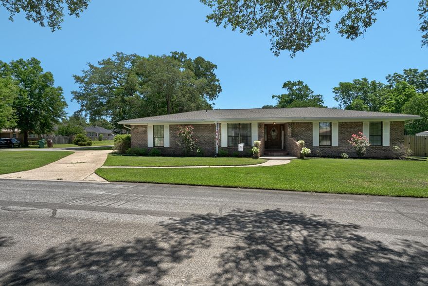 Welcome to your dream home! This all-brick beauty is situated on a generous corner lot that embodies curb appeal and that boasts a horseshoe driveway for ample parking. The residence offers an array of desirable features and upgrades, making it the perfect place to call your own. As you step inside, you'll be greeted by an inviting sunken living room, adding a touch of elegance to your everyday living. The entire home showcases gleaming tile flooring, not only ensuring durability but also providing a modern and easy-to-maintain aesthetic.