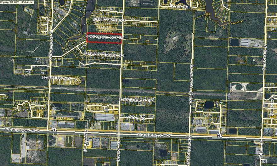 A beautiful wooded dry 10 acres parcel on Mussett Bayou Rd. Most of the work is complete for a 15 1/2 lot subdivision. Most of the infrastructure is already in place. Asphalt road, a swale drainage system, underground utilities, and electric.