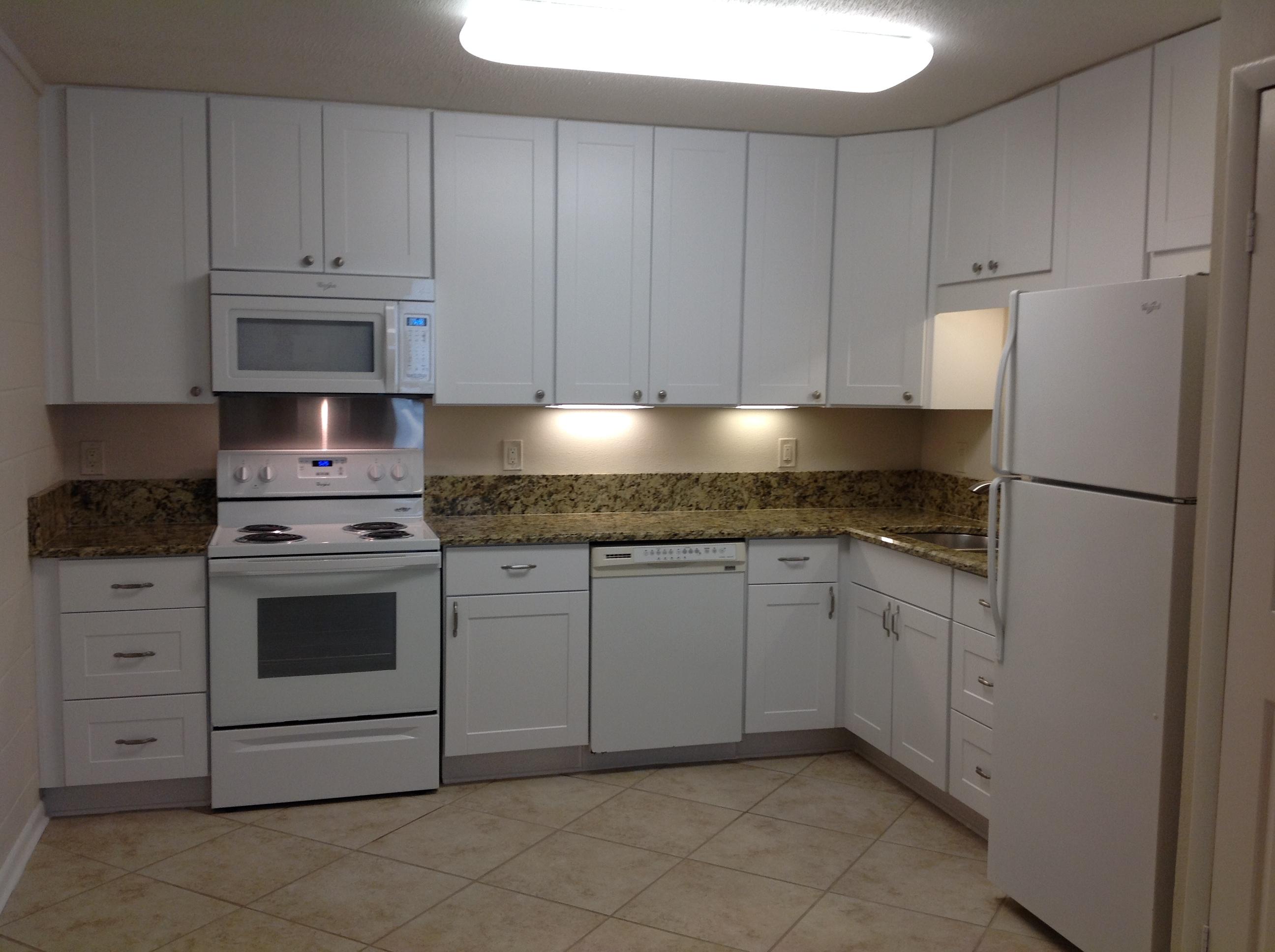 This 2 bedroom 1 bath condo has been renovated with new tile throughout, granite counter tops, new appliances, new cabinets in kitchen and bath. A front loading washer and dryer has been installed to complete the updating. The units here rent for 850.00 per month plus. As an investment, this could produce 5% or more. It's close to the beach, and is easily rented. A short walk to the beach.