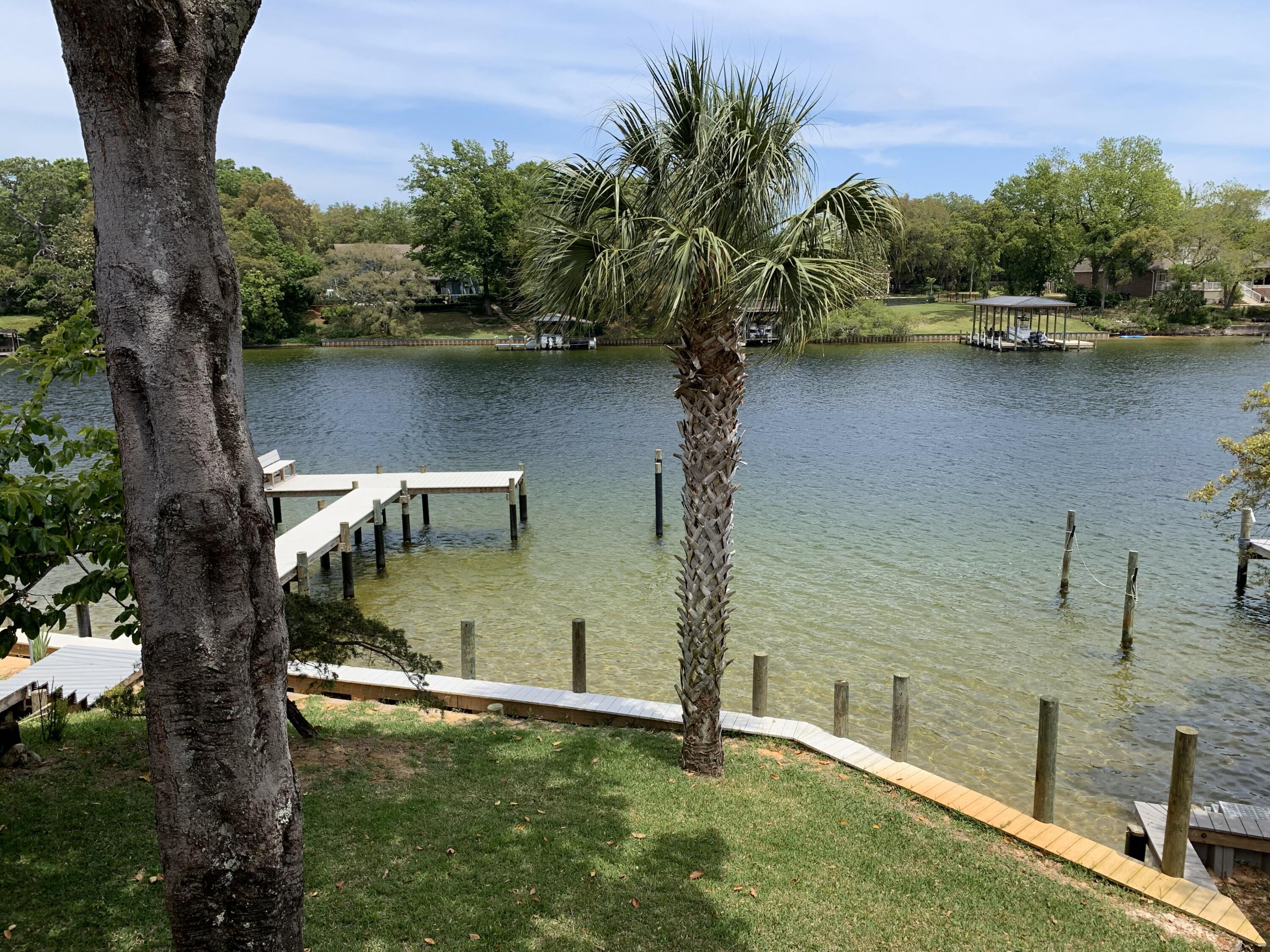 Welcome to your ''hard-to-find'', water front, rental home on Don's Bayou in Fort Walton Beach! Walk through the front door to be greeted by beautiful bayou views. This home has been lovingly maintained and the main floor living space includes 3 good sized bedrooms and 3 full bathrooms, a well equipped kitchen with granite countertops, large refrigerator, range, microwave, new dishwasher and a reverse osmosis water filter. There is new LVP installed throughout the whole main floor. The dining room overlooks the bayou and there's a little breakfast nook off the kitchen. You'll find additional storage in the laundry room and downstairs is a family room/den that opens to the backyard and easy access to the water. Enjoy the huge soaker tub in the renovated, spacious, master Enjoy the huge soaker tub in the renovated, spacious, master bathroom. The home includes your own personal boat dock and an outdoor shower for those returning from the water. Enjoy gorgeous views from the deck or the comfort of the backyard area. Rentals like this don't come around very often so give us a call today!