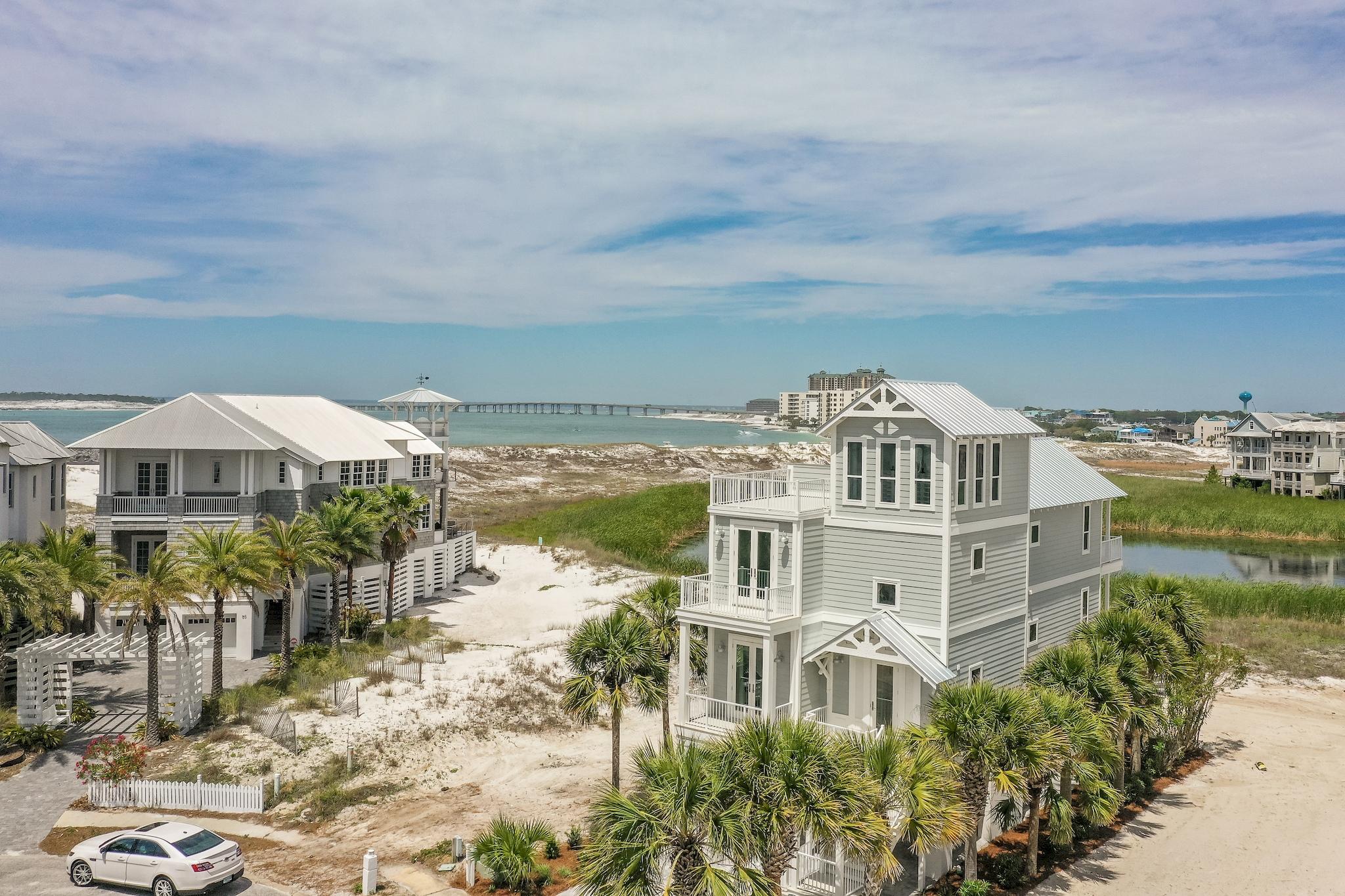 This home has been completely renovated. Almost everything inside and outside is brand new to include all new AC, electrical fixtures and plumbing fixtures, new roof, flooring and an improved floor plan with 4th bedroom plus a bunk room. The views from this house are absolutely amazing and overlook the Gulf of Mexico, East Pass and Destin Harbor giving owners breathtaking sunsets.Destin Pointe is the only gated beach community to boast two separate beach experiences in one beautiful gulf front community.