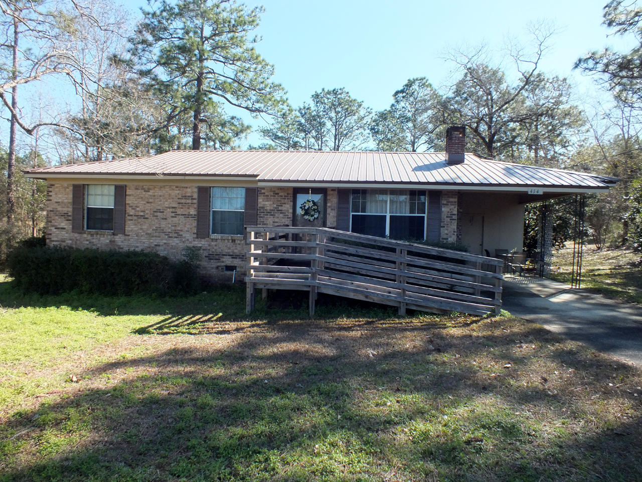 Very well maintained brick home on a large, almost 2 acre lot, in the Ten Lakes Estates subdivision. The home is move-in ready, handicap accessible, and has a waterview from the front yard. The central heated and cooled area does not include the auxiliary heated and cooled 16x27 Florida Room, which overlooks the back yard and provides access to it via the back covered deck. There is a second rear carport behind the house and an old barn/shed at the back of the property. Ten Lakes Estates is located approximately 5 miles north of historic downtown DeFuniak Springs, recently name the best small town in Florida by Main Street USA, and within an hour of the dining, shopping and beaches of South Walton.
