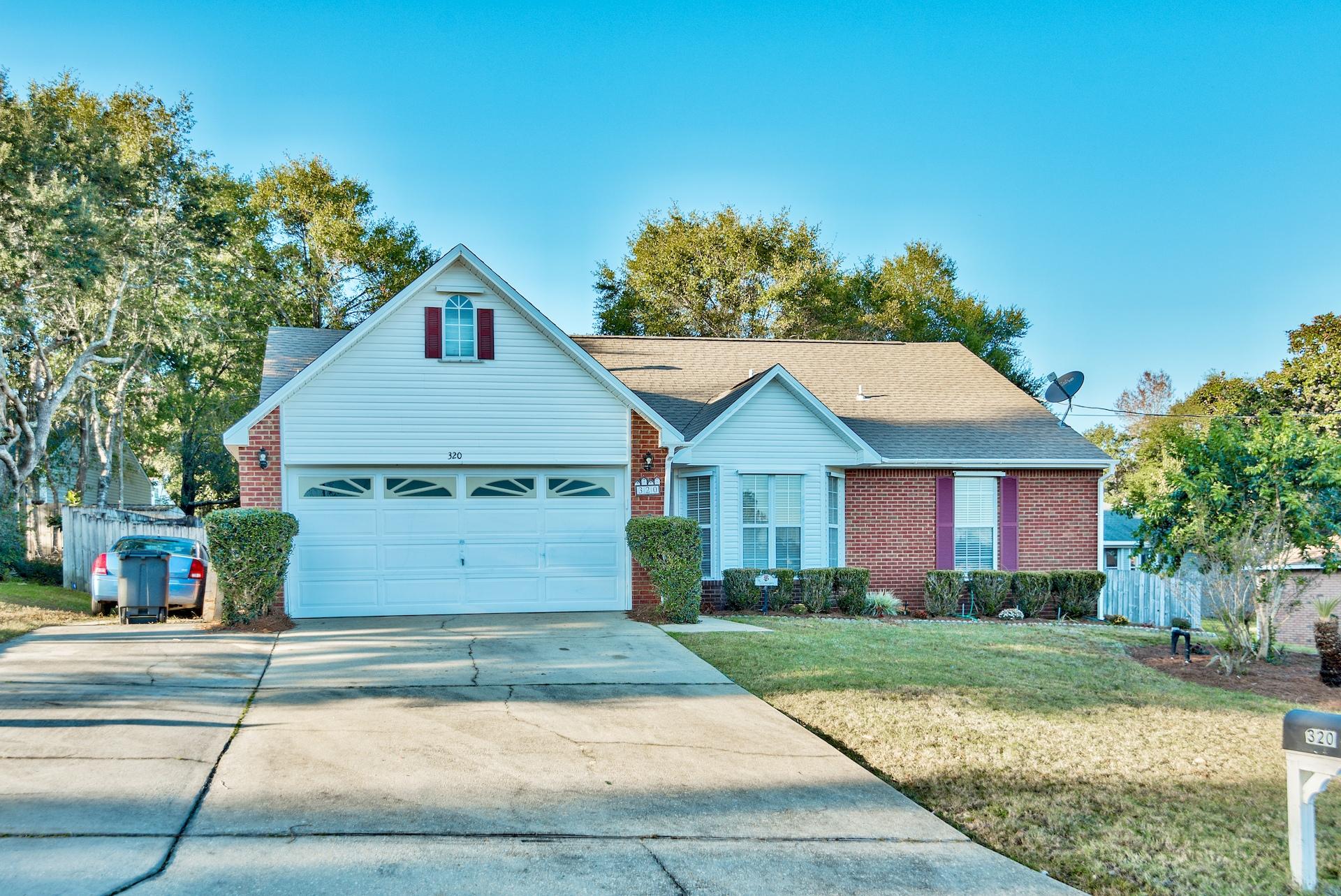 WONDERFUL, AFFORDABLE HOME IN GREAT NEIGHBORHOOD & WITHIN WALKING DISTANCE TO EGLIN. A fantastic floor plan, updated Kitchen & Baths & fresh interior paint set this home aside from the others! A high vaulted ceiling provides an open feel in the spacious living area w/fireplace. Entertain in style from your formal dining room w/bay window or dine more casually in your large Kitchen. Large center island w/ new sink & granite looking formica countertops, SS appliances, pantry & stunning new light fixtures accent the beautiful kitchen. Spacious 1st floor Master adjoins updated master bath w/ his & her sinks, jetted tub/shower & 2 custom closets. 2nd Bedroom on main level and 2 additional bedrooms & 2nd bathroom are located upstairs along with a loft