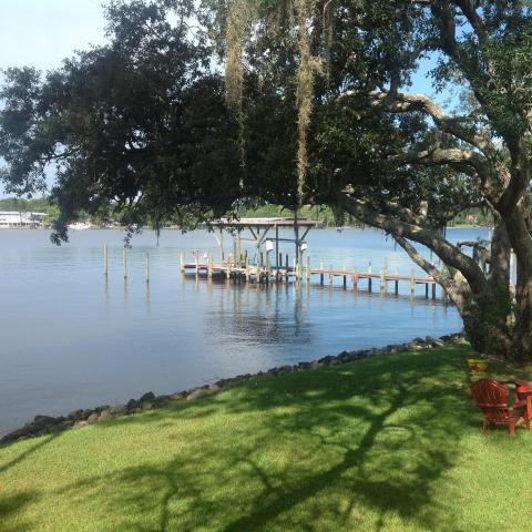 WATERFRONT FLOOD ZONE X Enjoy 145 foot of rock seawall with deep water. Watch the Niceville fireworks on your large deck 1 block from public boat ramp. For the Boater a Deep Water Dock with an additional Covered Boat slip with 6000 lb. Lift for a Pontoon, park a 50 ft. boat and a jet ski on the sides. The dock is great for fishing or just plain relaxing. There is a full bath off the deck for clean up after boating. Home has large bedrooms and 3 full baths, a Family room with fireplace plus a large Sun Room. Large kitchen with gas stove granite counters, lots of cabinets and great appliances, a large eating area, inside utility room, split bedrooms, crown molding, a oversized 2 car garage, circular drive for parking multi decks overlook the water, newer central ac unit plus a Metal Roof