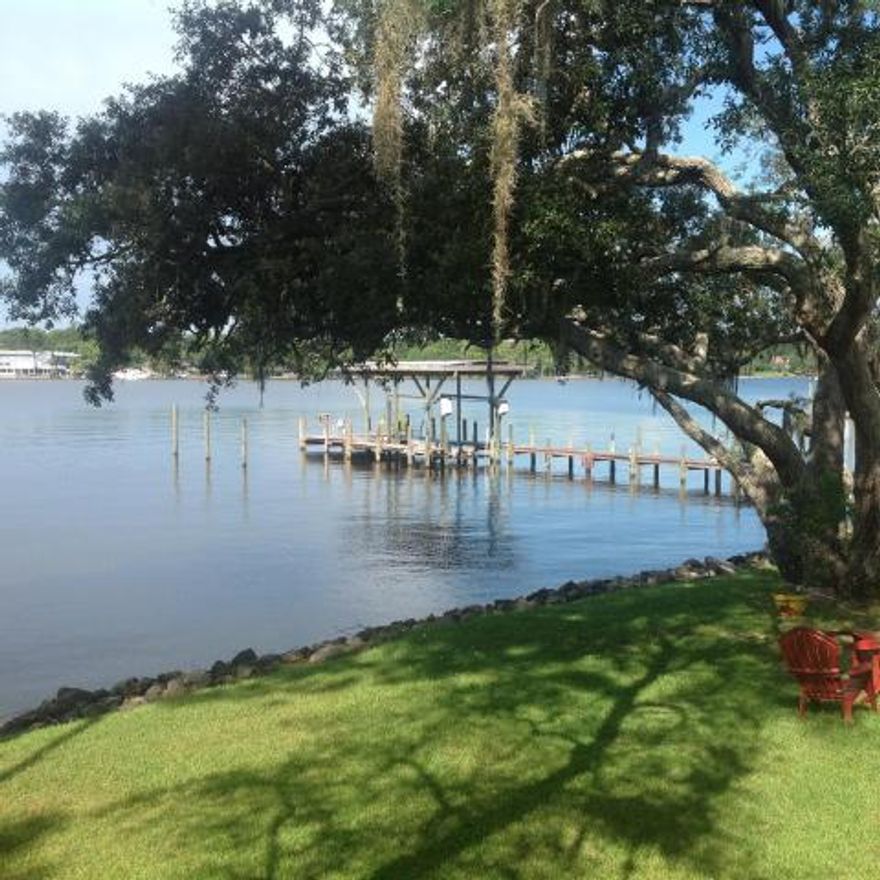 WATERFRONT FLOOD ZONE X Enjoy 145 foot of rock seawall with deep water. Watch the Niceville fireworks on your large deck 1 block from public boat ramp. For the Boater a Deep Water Dock with an additional Covered Boat slip with 6000 lb. Lift for a Pontoon, park a 50 ft. boat and a jet ski on the sides. The dock is great for fishing or just plain relaxing. There is a full bath off the deck for clean up after boating. Home has large bedrooms and 3 full baths, a Family room with fireplace plus a large Sun Room. Large kitchen with gas stove granite counters, lots of cabinets and great appliances, a large eating area, inside utility room, split bedrooms, crown molding, a oversized 2 car garage, circular drive for parking multi decks overlook the water, newer central ac unit plus a Metal Roof