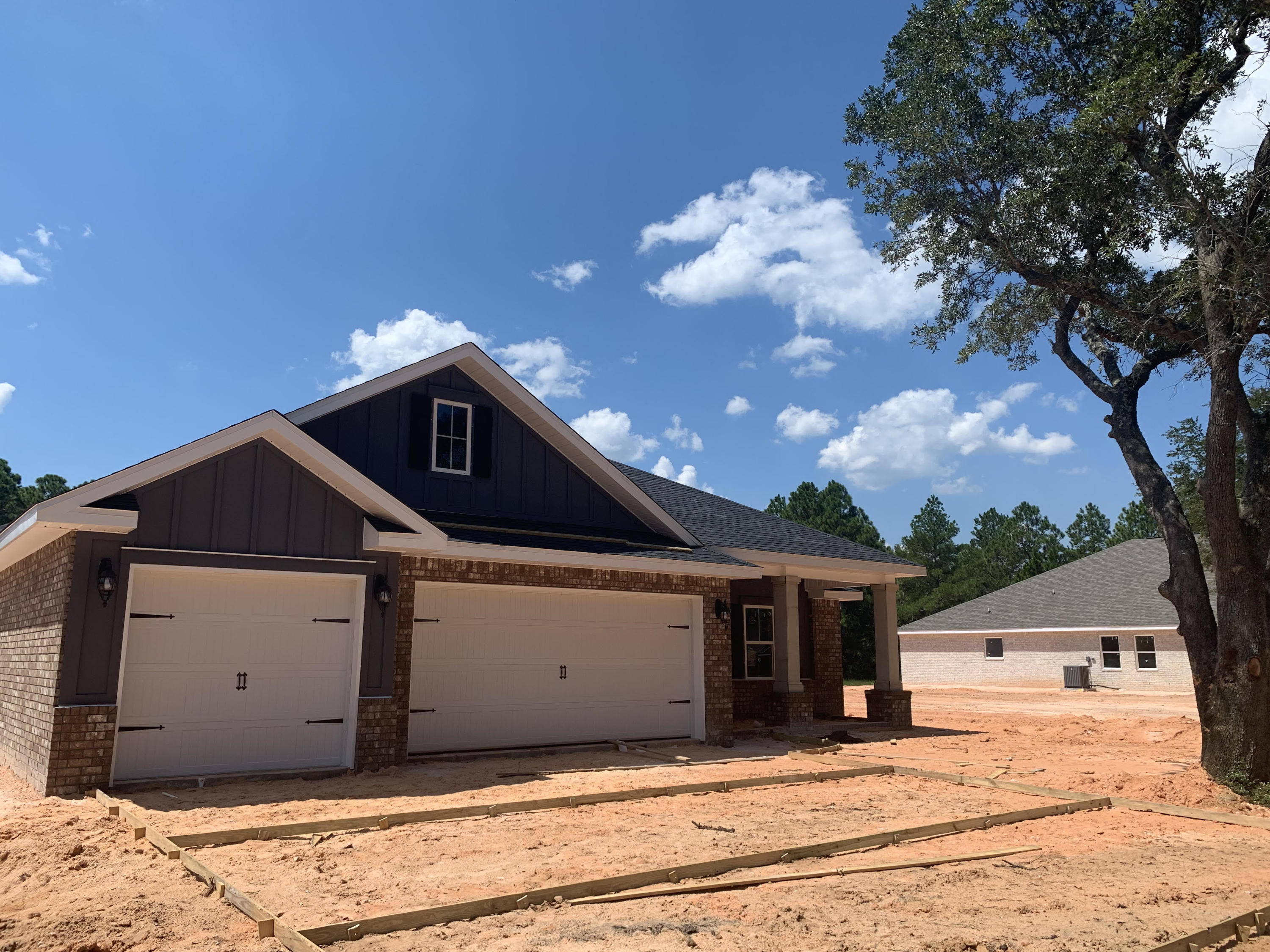 *COMPLETE & READY END OF SEPTEMBER 2020* Please TEXT Agent for construction status.**Brand New Floor Plan & Location central to everything! 7 miles from Navarre Beach Bridge and 12 miles to 1-10 *4 Bedrooms *Dining can double as an Office /Playroom *Open Floor plan *3 Full Baths * 3 Car Garage * Lot is 1/2 acre on sewer * Covered Entry *Mohawk Luxury Wood Vinyl Plank in Formal Areas/Wet Areas *Mohawk Carpet in Bedrooms *Soaking tub & Builder's Signature Walk in Tile Shower in Master Bath *Kitchen has Huge Walk in Pantry, Granite Counter tops & Large Island *Stainless Steel Appliances *Spacious Family Room with 10 Ft Flat Ceilings *Eglass Windows look onto the Rear Yard * Large Lanai with 10' ceiling & ceiling fan/light combo *Fabric Shields Included *Builder/Centricity Warranty