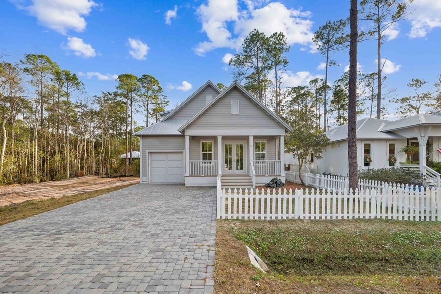 NEW PICKET FENCE with DOG RUN!! Nestled in Point Washington, this Florida cottage features luxury vinyl plank flooring, upgraded stainless steel appliances (including a gas range with pot filler), water filtration system, shaker-style cabinets, quartz countertops, and a main-floor primary suite with an en-suite bath. Outdoors, enjoy inviting porches, a screened back porch with outdoor kitchen, a charming picket fence, and a dedicated dog run--perfect for entertaining and everyday living. A short walk to Bay access and minutes from South Walton's beaches, this home is part of a vibrant 30A community where residents live, work, and play.