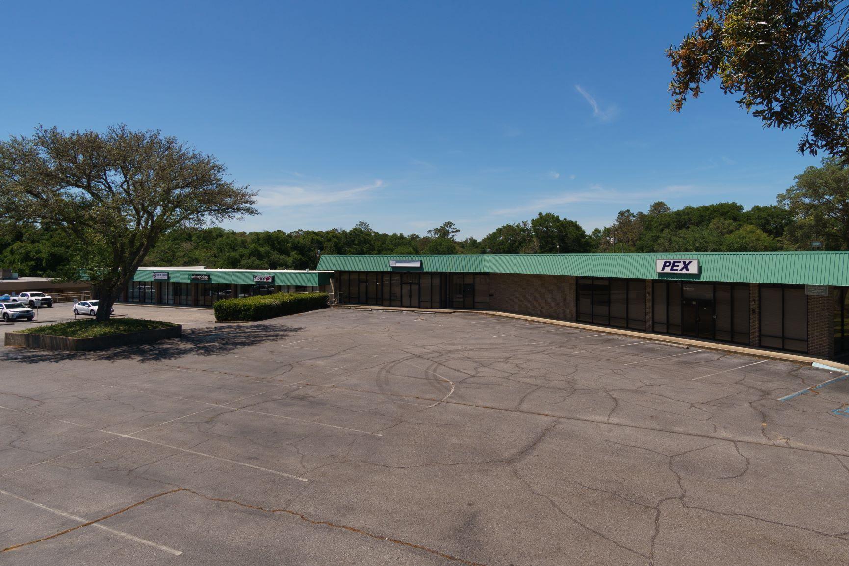 Centrally located in Okaloosa County, Pointe Plaza is located in Valparaiso just west of Highway 20. This 3682 SF unit has an open floor plan which can accommodate many different uses. The space is designed with open areas, 2 restrooms and just a few interior walls. Each tenant has the ability to place signage above its door as well as on the existing pylon signage on Government Avenue. Lease rate is $12/SF + $3.25/SF + sales tax = $4,969.32 per month. This space was formerly occupied by a church.We have space ranging from 1000 ~ 9600 SF available.