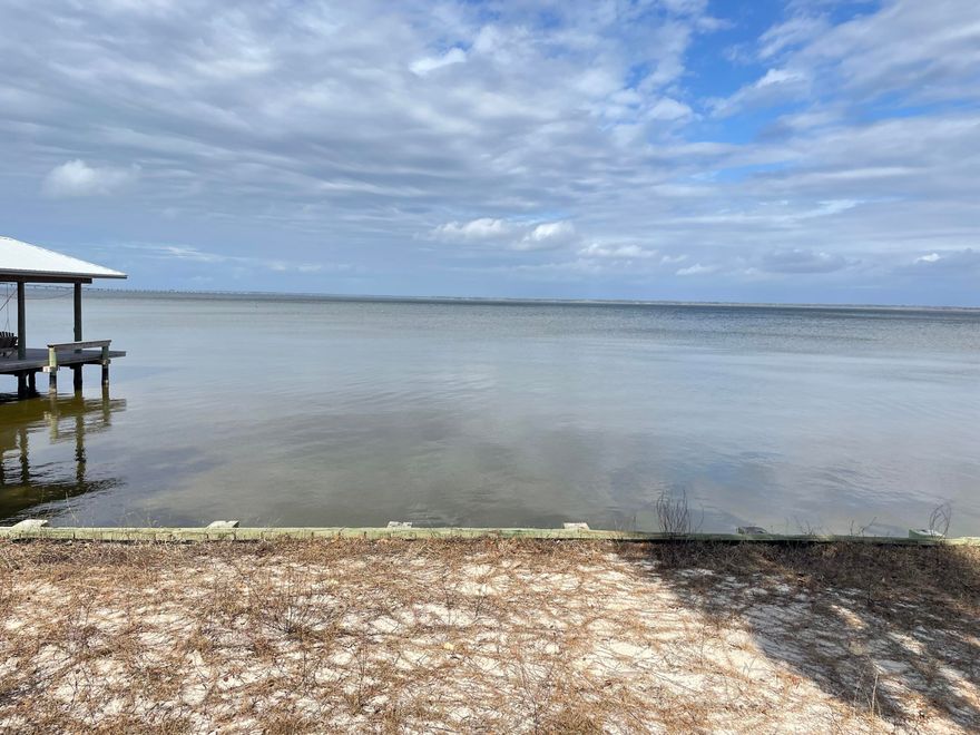 The perfect location for your waterfront home with 50ft of bay frontage in Grayton Bayou. There is already a seawall in place along with  a community pool and Ranchette public park is nearby. North of Grayton Beach, it's a quick drive to 30a and easy access to Hwy 98.  Buyer to verify all information, plot dimensions are approximate and should be verified.