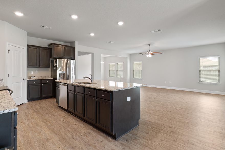 PRICE REDUCED !!  2 HOMES IN ONE!!!! 2 PRIMARY bdrms with en suite & separate living space, great for teenagers or inlaws! Your dream home is located just North of I-10 in a 6 year old subdivision. Convenient 3 car front entry garage, walk thru a large laundry room and into the great living space. The beautiful kitchen has a large island with all stainless steel appliances with breakfast room opening up into the great room along with a Formal dining room.  The first master bath has a garden tub with separate shower, dual vanity sinks, and a large walk in closet. Vinyl Hardwood flooring in living areas with carpet in the bedrooms.