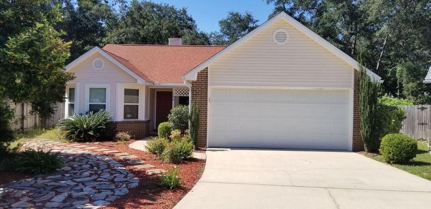 Sitting pretty on a large, private lot in a quiet neighborhood is a meticulously maintained home with style and charm. A thoughtful floor plan allows for living large. Tasteful hues throughout the home complement the refreshingly attractive finishes and appointments. Hardwood floors are the base for the living room accented with vaulted ceiling and fireplace. The floor plan allows for the cook to be in the center of activity with the kitchen and dining area fully open to the living room. Quartz counters and breakfast bar invite you to sit, Outside you'll be delighted by the pergola and large privacy fenced back yard with a variety of ornamental trees mixed with nature. All landscaping is xeriscape themed for ease of maintenance. Just minutes to beaches, bases, fine dining and shopping