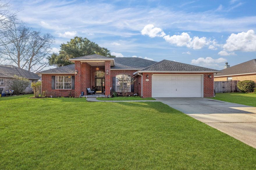 Welcome to this charming 4-bedroom, 2-bathroom brick home in the heart of Pace, Florida! Freshly painted throughout with a brand-new roof, this home offers a perfect combination of comfort and style. The cozy kitchen features quartz countertops, stainless steel appliances, rustic-style cabinets, and a breakfast nook, ideal for casual meals. A formal dining room adds an elegant touch, perfect for entertaining or family dinners. The living room, complete with a cozy fireplace, features high ceilings that enhance the open and airy feel of the space. The primary suite is thoughtfully located on the opposite side of the home for added privacy and boasts a spacious bathroom with a garden tub, stand-up shower, double vanity, and walk-in closet. Three additional bedrooms and one bath are convenie iently situated on the other side of the home, ideal for family or guests. SELLER IS OFFERING A CREDIT FOR NEW FLOORING ALLOWING YOU TO PERSONALIZE THE SPACE TO YOUR TASTE. Step outside to the covered patio that leads to the spacious backyard complete with mature trees, a fire pit, and a shed for extra storage. Hardwood floors flow throughout the home, and the oversized garage offers plenty of space for vehicles and storage. With its serene setting and modern updates, this home is perfect for those seeking both style and functionality in a peaceful Pace neighborhood.
