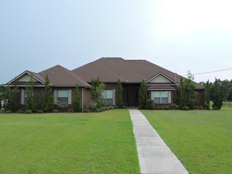 Welcome to this beautiful 2011 custom home originally built as builders own home so there is every type of upgrade you could imagine with over 4100 sqft, 5 bedrooms, 4 1/2 baths, situated on a flat 1 acre lot with an in-ground pool. From the 3 stack crown molding, high ceilings, chandeliers, 2 Master Suites (300+ sqft each) , custom lighting throughout, custom cabinets in the oversized kitchen (200+ sqft) featuring granite countertops and stainless steel appliances just to name a few. Both master suites feature large walk- in tile showers, spacious closets, and separate access to the covered rear porch. Home has great curb appeal with beautiful low maintenance landscaping, gazebo with electricity and propane connection and in-ground pool as well as a 150 ft well for the irrigation