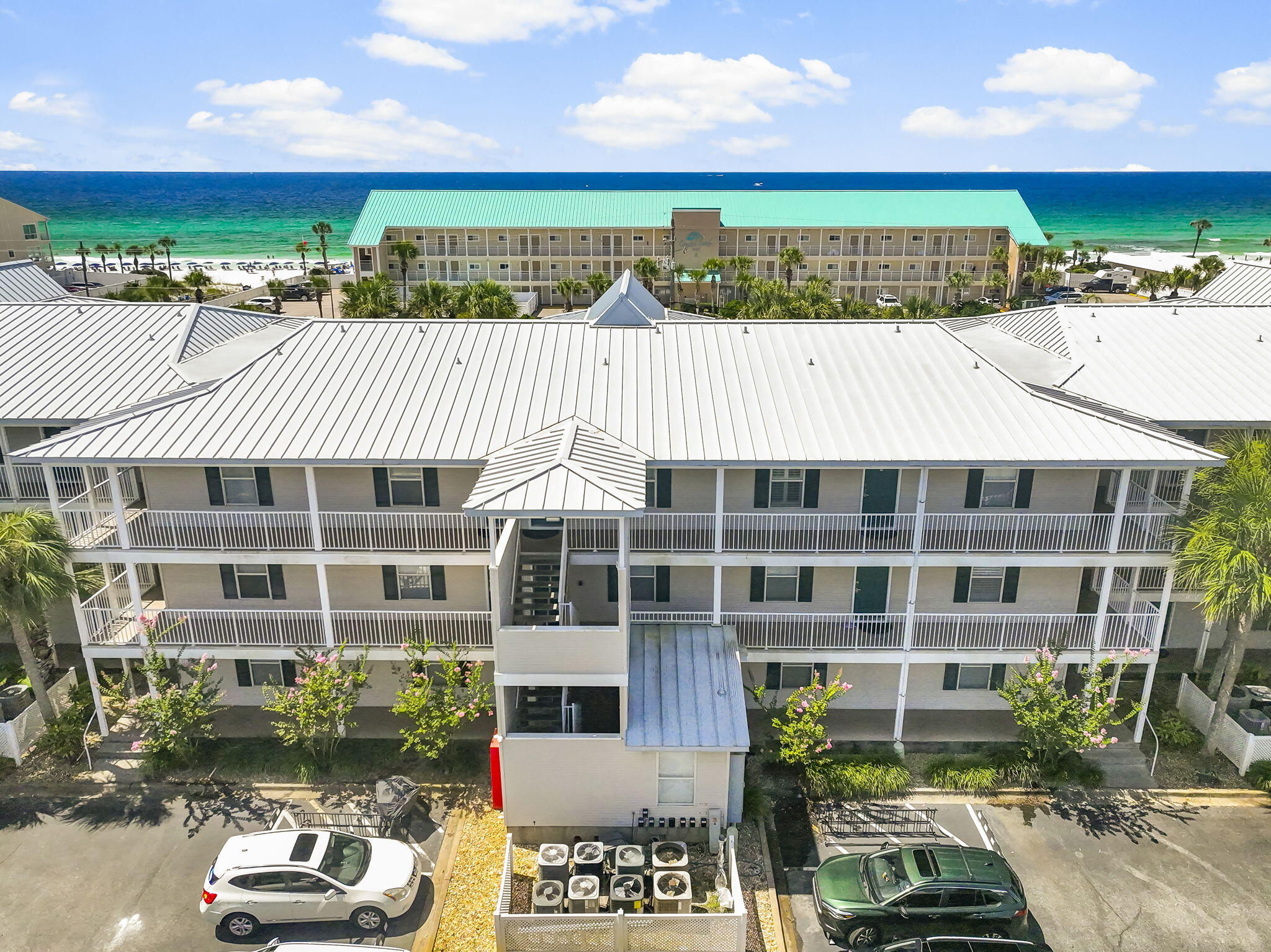 Enjoy Gulf views and easy beach access from this top-floor one-bedroom, one-bath condo at Grand Caribbean West in Destin. This spacious unit is thoughtfully designed to maximize comfort and rental potential, featuring a hallway with built-in bunk beds, an in-unit washer and dryer, and a full-size kitchen--rare for a one-bedroom condo in this area. The open living and dining area flows seamlessly to a large balcony, perfect for taking in the coastal scenery. Previous updates include luxury tile flooring, an updated bath with a newer tub and toilet, a 2019 HVAC system, 2021 hot water heater, and the popcorn ceiling removed in 2022.Located directly across from the beach, this condo offers the best of both worlds--beautiful Gulf views with the added security of not being directly on the sand. Grand Caribbean West provides excellent community amenities, including a pool, hot tub, grilling area, and picnic pavilion. Whether you're looking for a turnkey vacation rental, a second home, or a cozy beach retreat, this unit is move-in ready and in a prime Destin location. All information is deemed accurate but should be verified by the buyer and/or buyer's agent if important. Schedule your private showing today!
