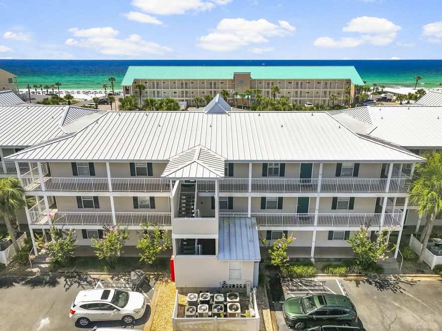 Enjoy Gulf views and easy beach access from this top-floor one-bedroom, one-bath condo at Grand Caribbean West in Destin. This spacious unit is thoughtfully designed to maximize comfort and rental potential, featuring a hallway with built-in bunk beds, an in-unit washer and dryer, and a full-size kitchen--rare for a one-bedroom condo in this area. The open living and dining area flows seamlessly to a large balcony, perfect for taking in the coastal scenery. Previous updates include luxury tile flooring, an updated bath with a newer tub and toilet, a 2019 HVAC system, 2021 hot water heater, and the popcorn ceiling removed in 2022.Located directly across from the beach, this condo offers the best of both worlds--beautiful Gulf views with the added security of not being directly on the sand. Grand Caribbean West provides excellent community amenities, including a pool, hot tub, grilling area, and picnic pavilion. Whether you're looking for a turnkey vacation rental, a second home, or a cozy beach retreat, this unit is move-in ready and in a prime Destin location. All information is deemed accurate but should be verified by the buyer and/or buyer's agent if important. Schedule your private showing today!