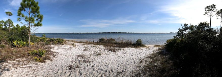 VACANT LAND ONLY Positioned in Mary Esther, this exceptional 3.38-acre waterfront property presents a rare opportunity with remarkable flexibility. The site is well suited for a private waterfront estate situated on a beach peninsula with a beautiful beach area.Just minutes from Hurlburt Field, the location is ideal for military members, defense professionals and families seeking proximity to one of the region's key employment centers. Residents and visitors will appreciate the quick connection to Fort Walton Beach and the convenience of being centrally located between Navarre, Gulf Breeze and Destin -- placing shopping, dining, beaches and daily essentials within easy reach